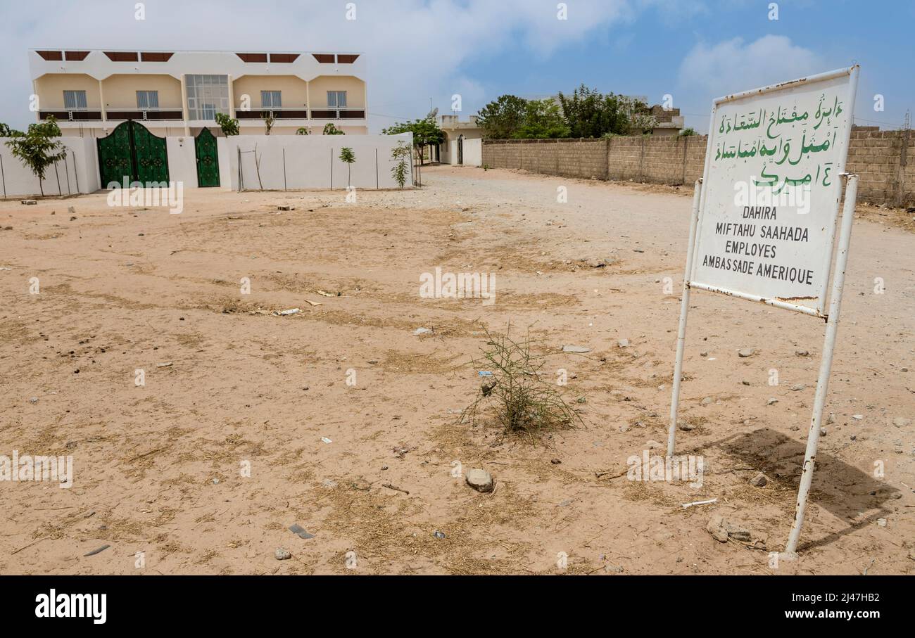 Senegal, Touba.  A Modern House in the Suburbs of Touba.  The sign in Wolof, in both Arabic and Latin script. Stock Photo