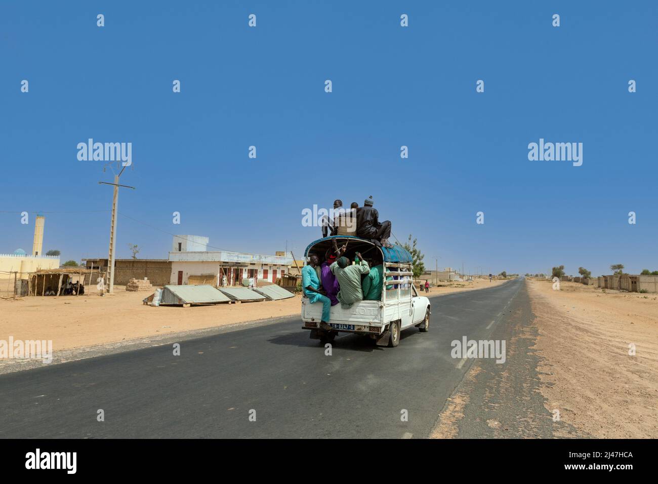 Senegal, Touba.  Vehicular Safety.  No Seatbelts; no Seats!  Inter-city Transport Leaving Touba. Stock Photo