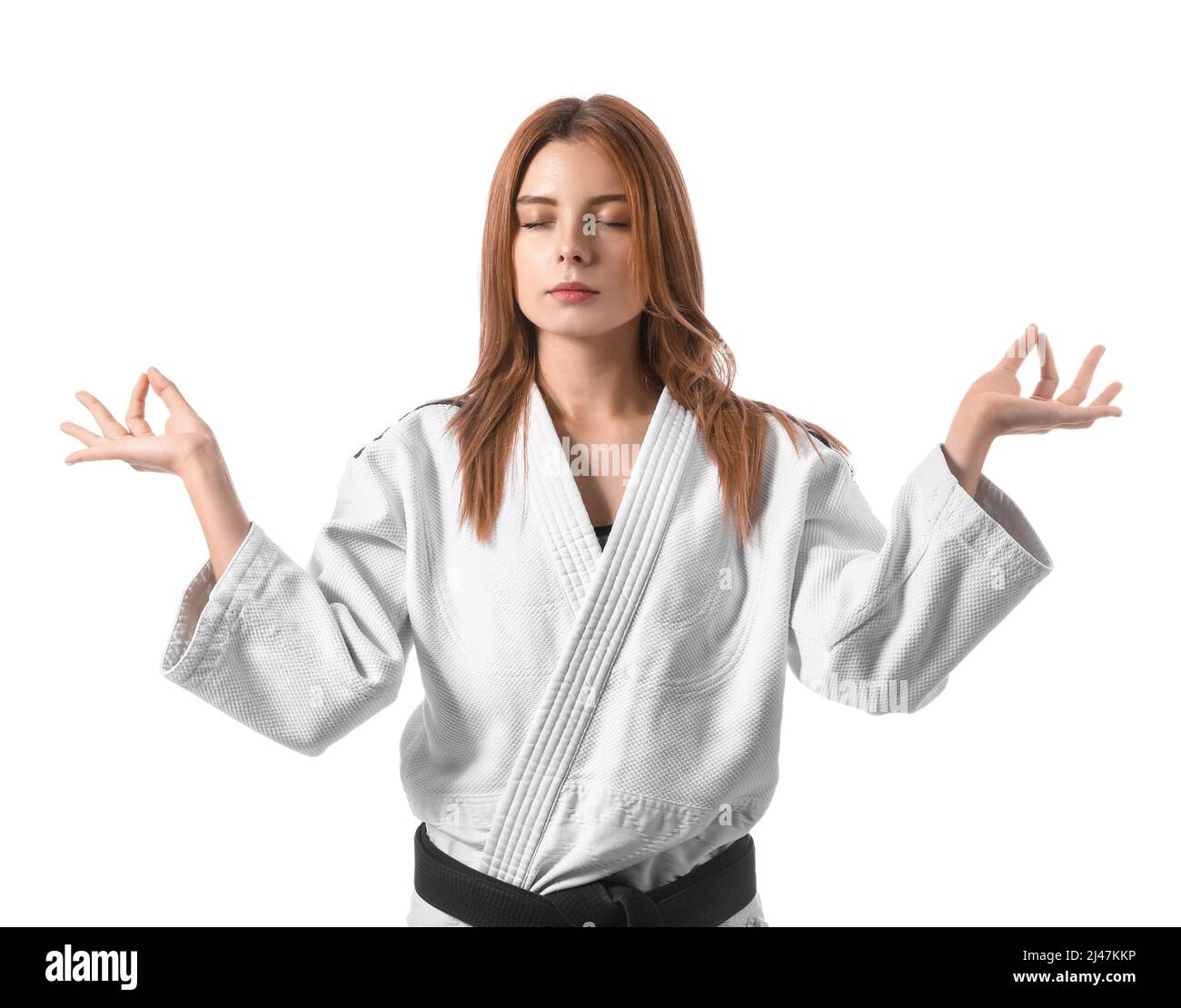 Female karate instructor meditating on white background Stock Photo Alamy