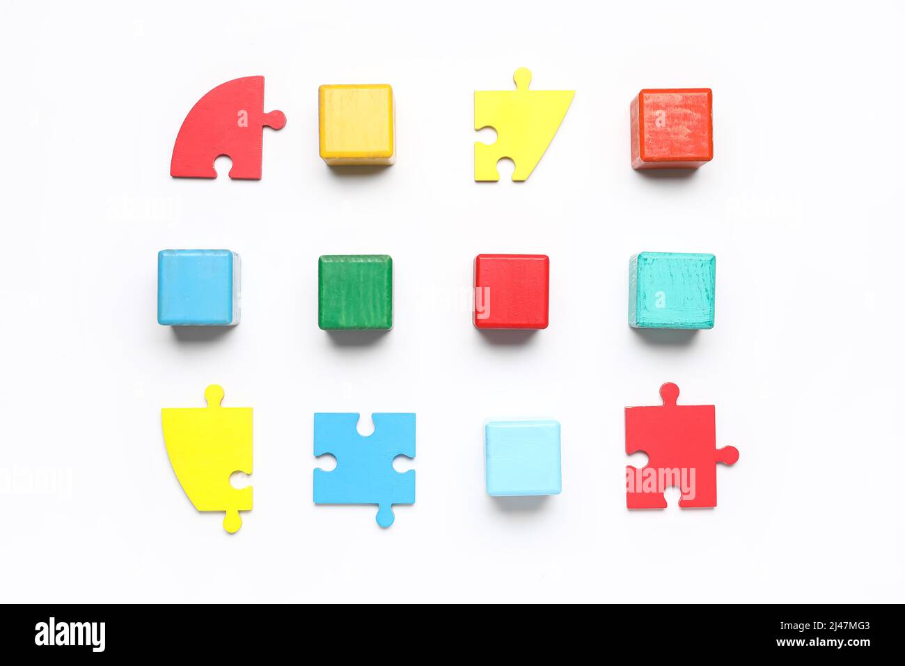 Colorful cubes with puzzle pieces on white background Stock Photo - Alamy
