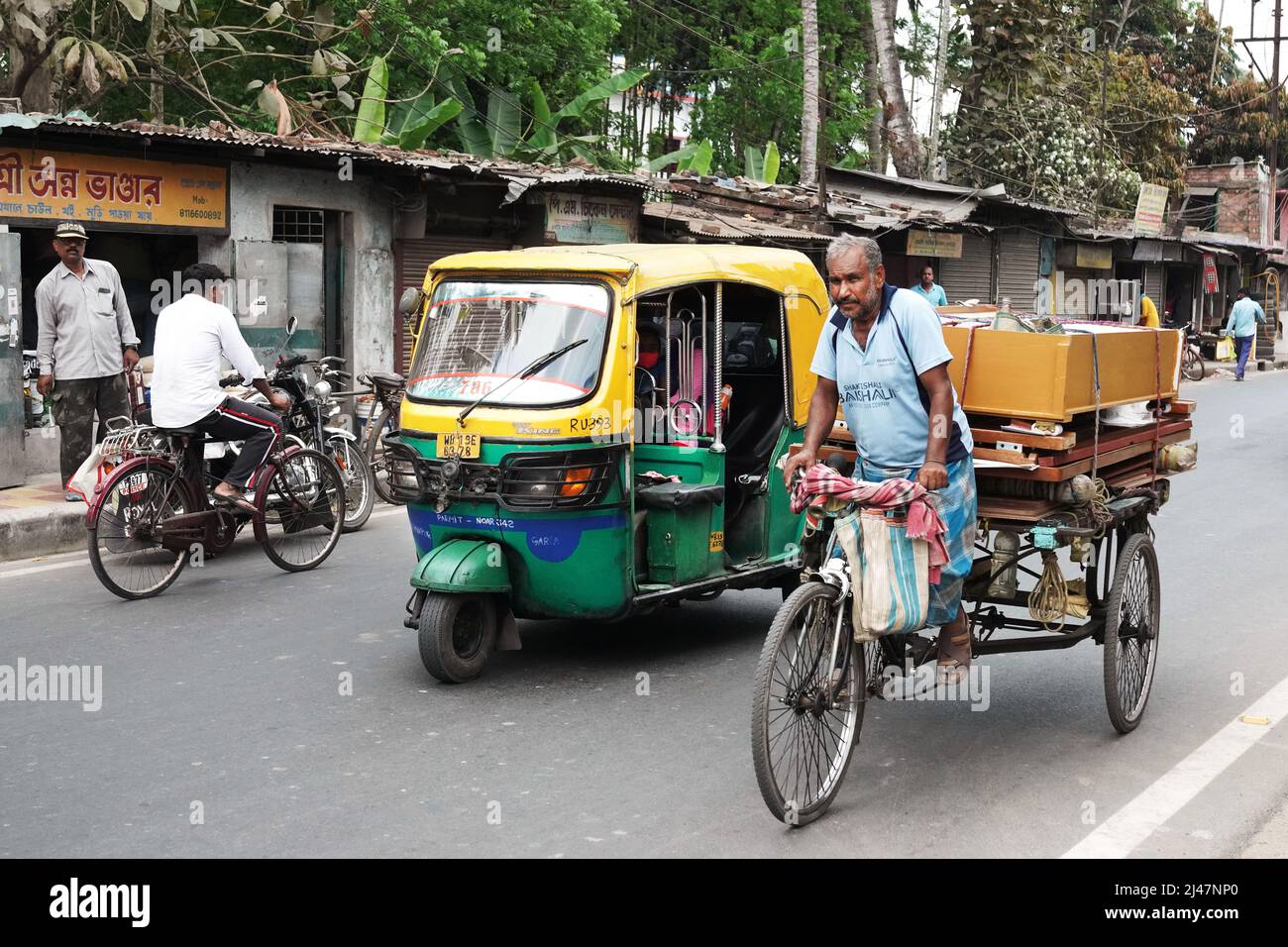 Bicycle, tricycle and rikshaw in Baluijhake/Dhosa village near Kolkata, India Stock Photo