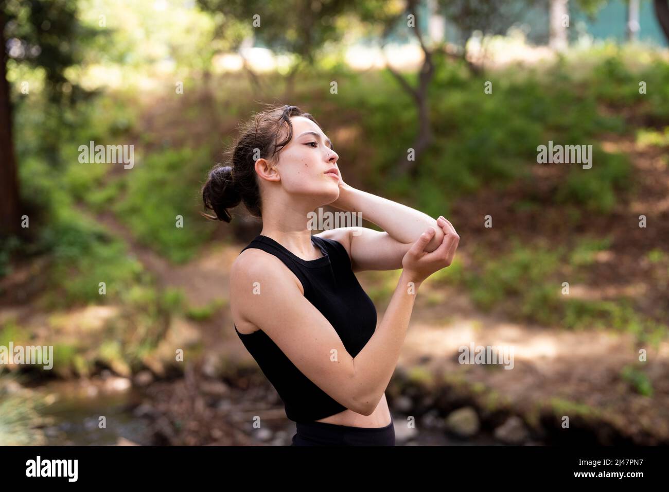 Teenage Dancer Acting Out Lost Love in Redwood Grove on the UC Berkeley Campus Stock Photo