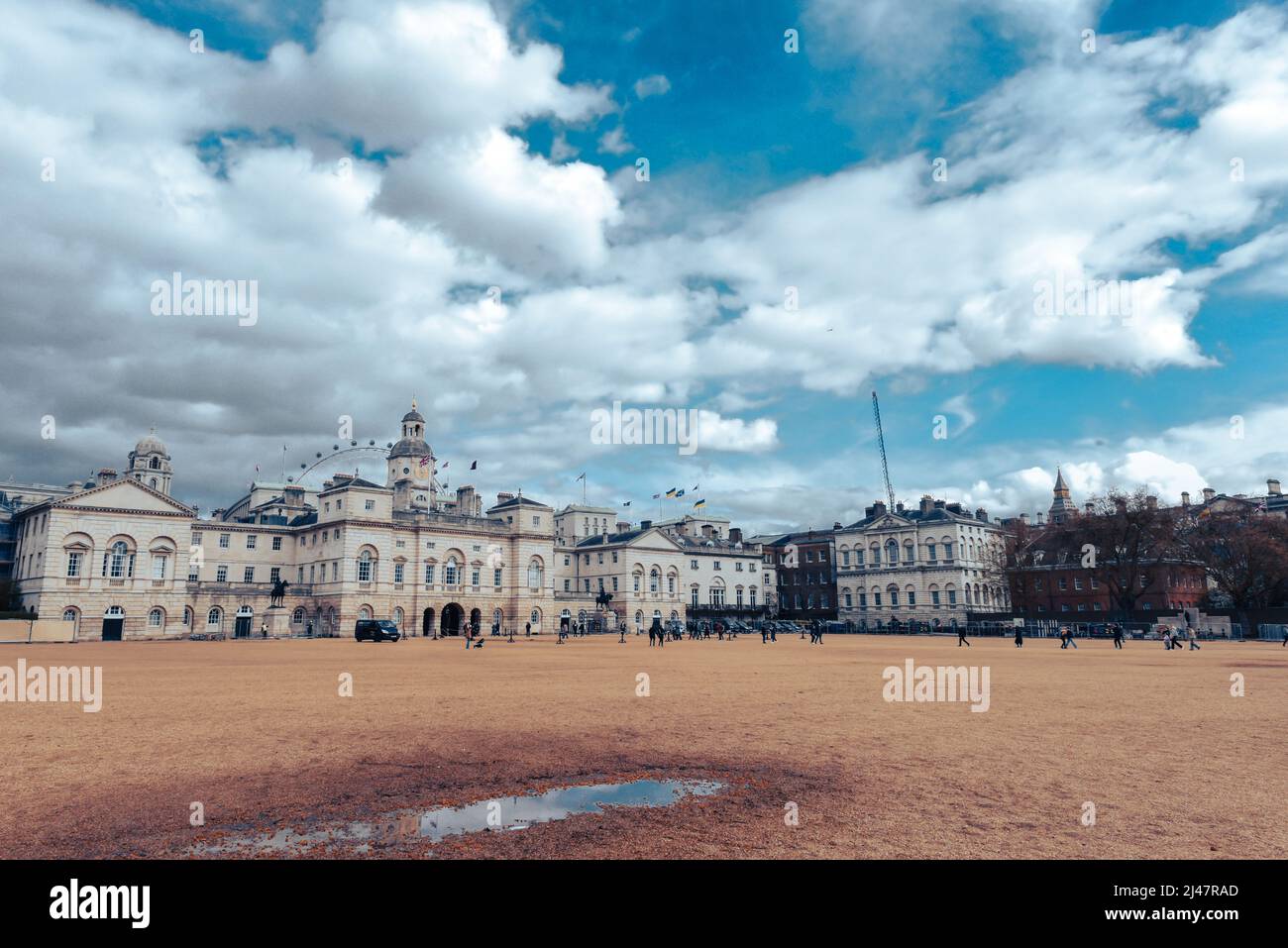Horse Guards Parade in London England with flying flags and London Eye in background Stock Photo