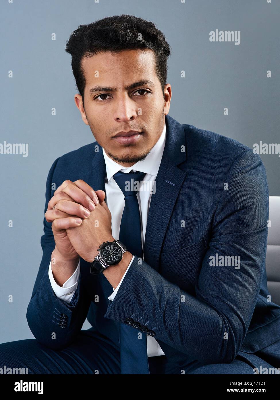 Its just business to him. Studio shot of a corporate businessman posing ...