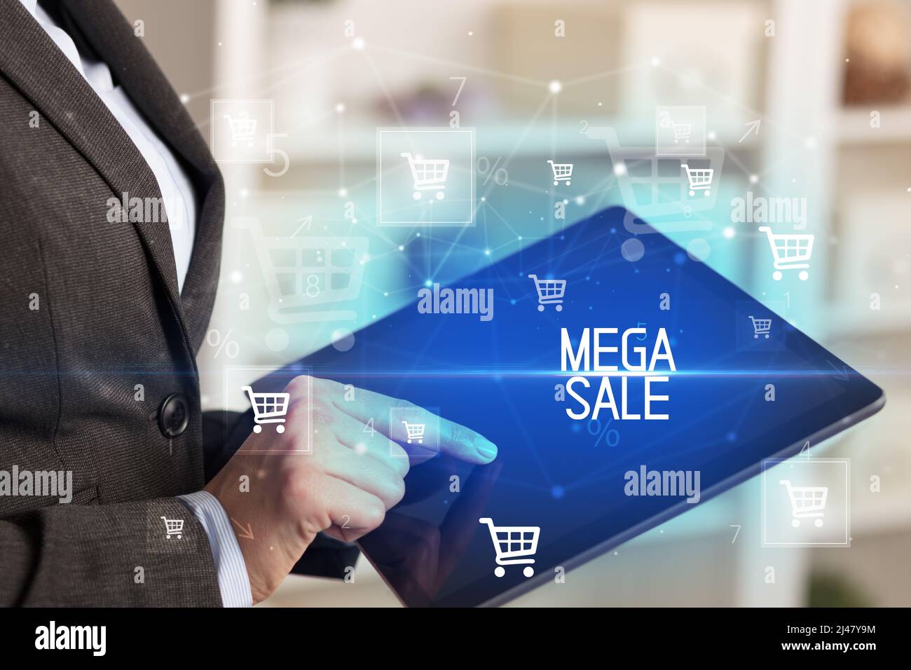 Young person makes a purchase through a tablet Stock Photo Alamy