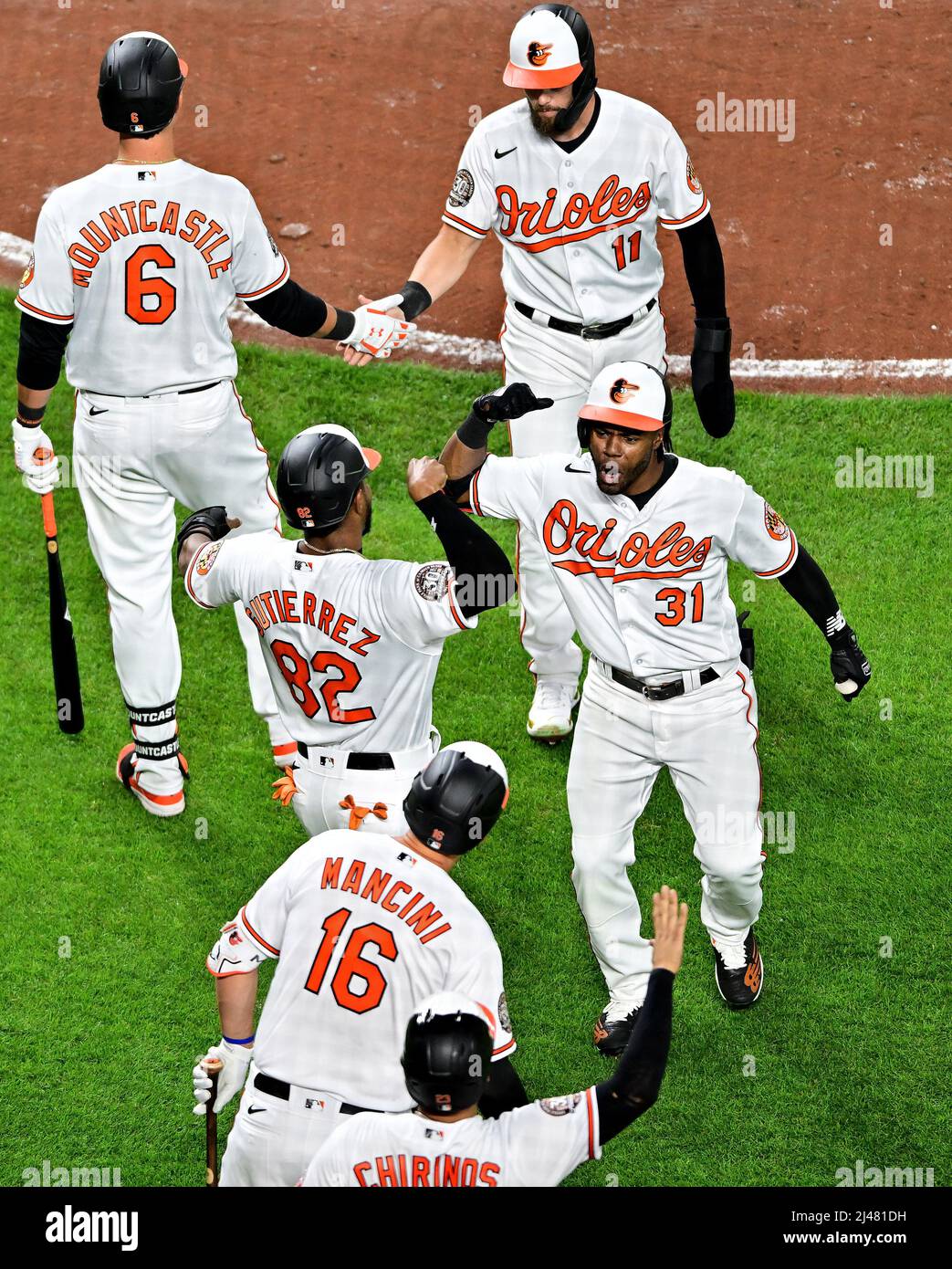 Baltimore, United States. 12th Apr, 2022. Baltimore Orioles' Cedric Mullins  (31) celebrates with teammates after a grand slam against the Milwaukee  Brewers during the second inning of a game at Camden Yards