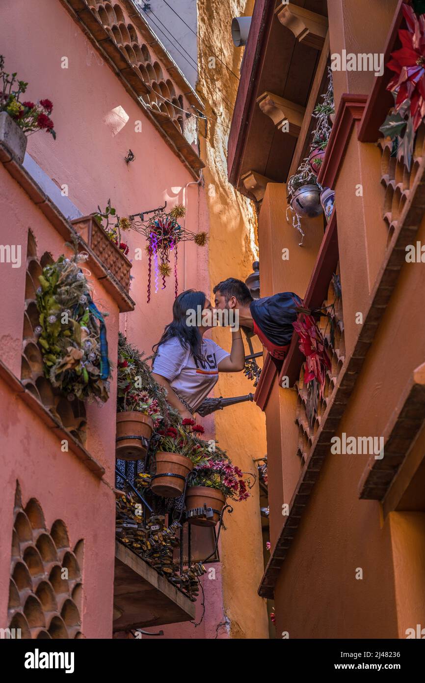 Quanajuato, Mexico - Dec 22, 2021. Kiss Alley Alleyway Colored Houses Guanajuato Mexico. Houses so close couple can exchange a kiss between balconies Stock Photo