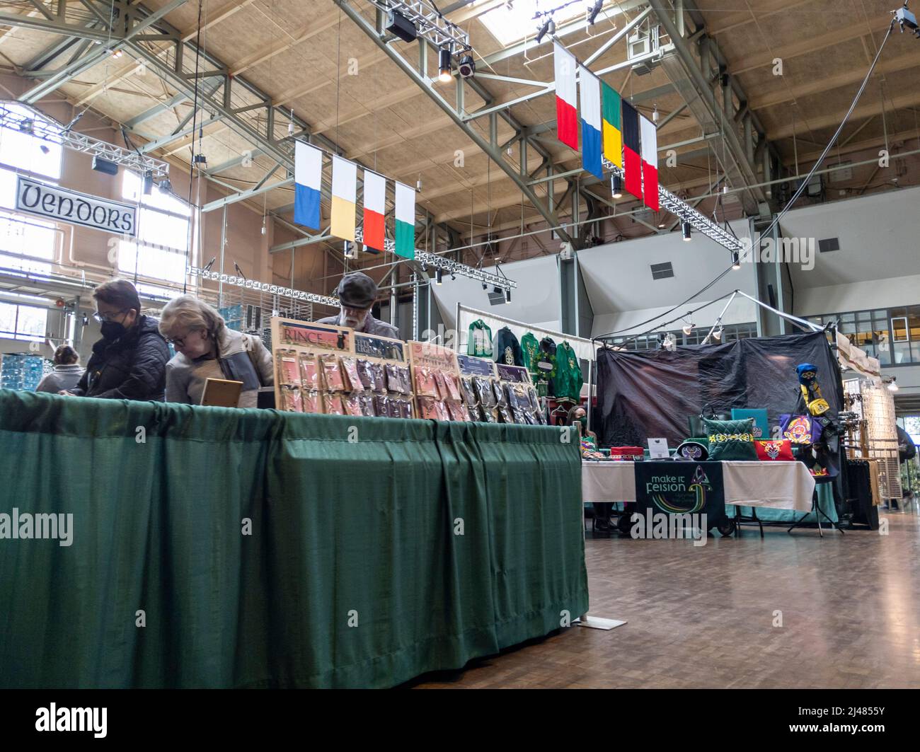 Seattle, WA USA - circa March 2022: People enjoying the Seattle Irish Week Festival inside the Armory Food and Event Hall Stock Photo