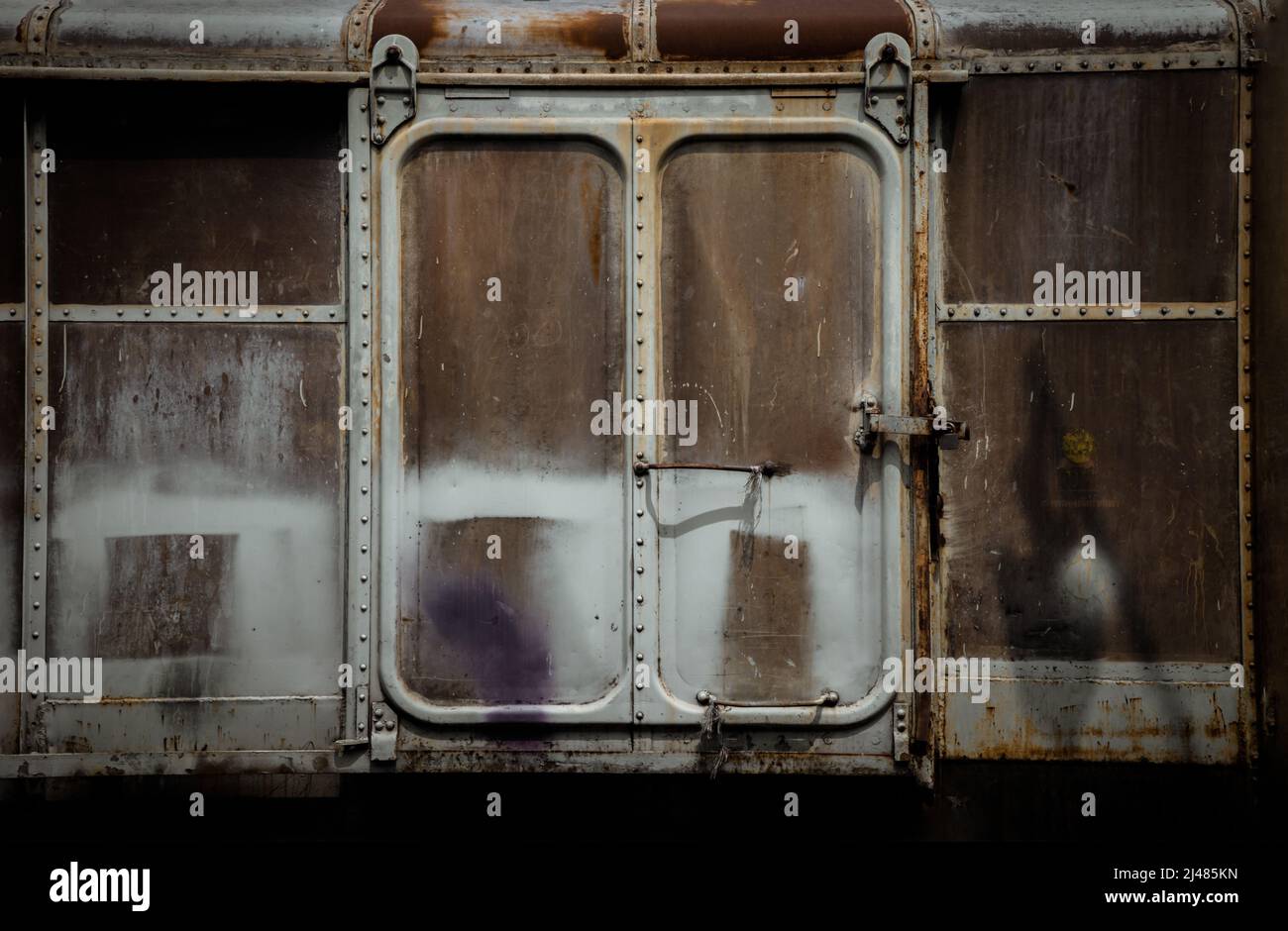 Metal locked padlock at Vintage railroad container doors gates in old