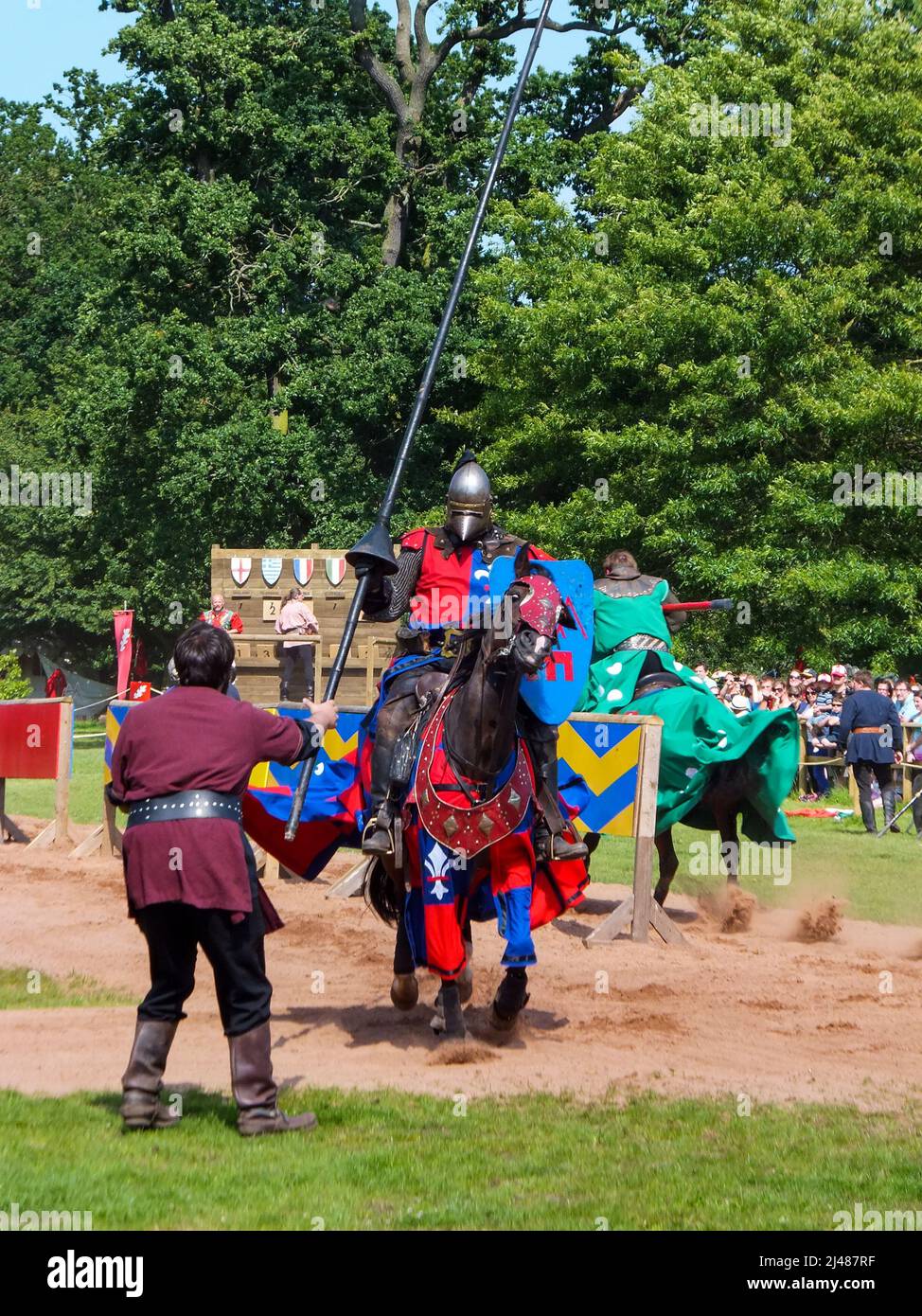 Reenactors portray contestants in a jousting match at Warwick Castle in Warwickshire, England, UK. Stock Photo