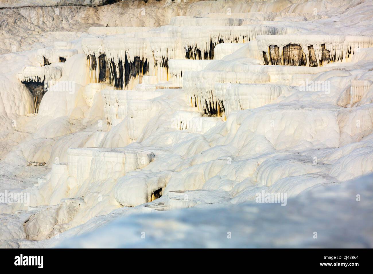 White travertine formations at hot springs of Pamukkale, Turkey Stock ...