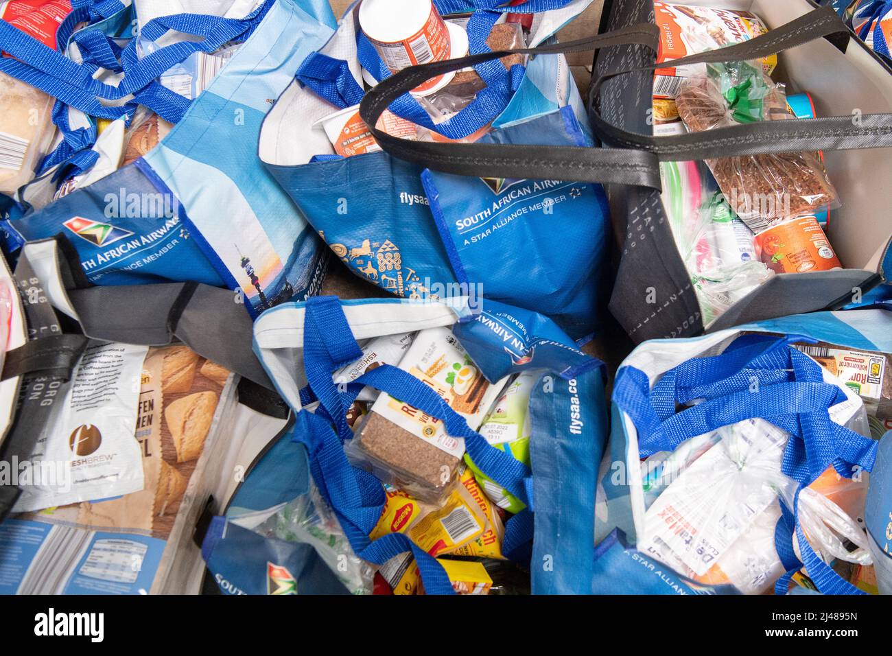 12 April 2022, Hessen, Frankfurt/Main: Packed bags of food stand in the warehouse of the Tafel Frankfurt. The Tafel in Frankfurt is currently struggling with the fact that it is receiving fewer donations in the face of higher demand. Photo: Sebastian Gollnow/dpa Stock Photo