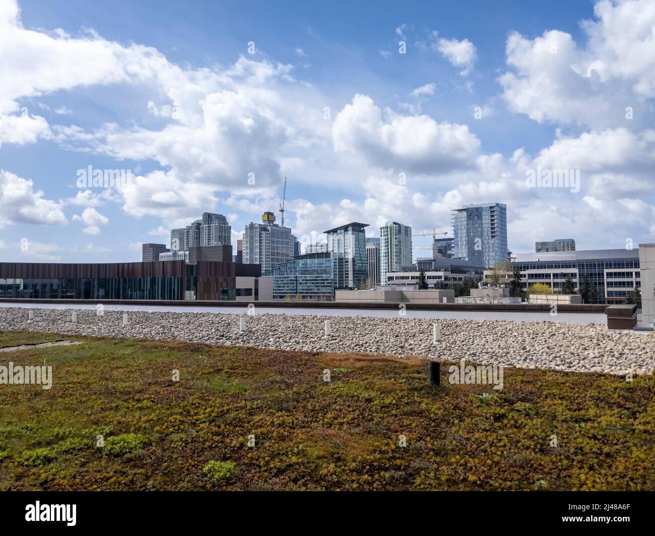 Bellevue, WA USA - circa April 2022: Wide angle view of construction happening in downtown Bellevue on a bright, cloudy day Stock Photo