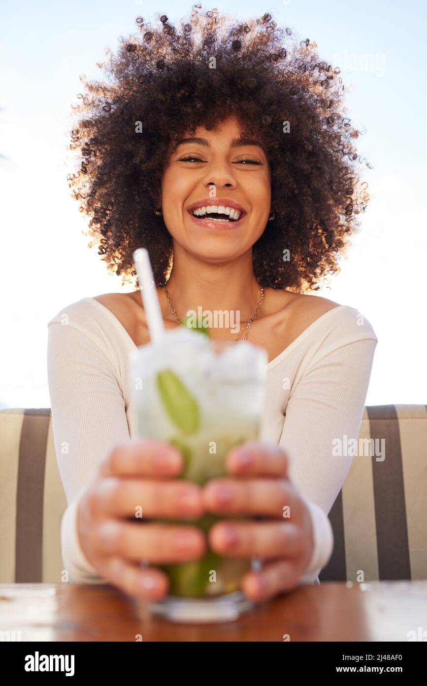 Cheers to me, baby. Portrait of a beautiful young woman having a drink