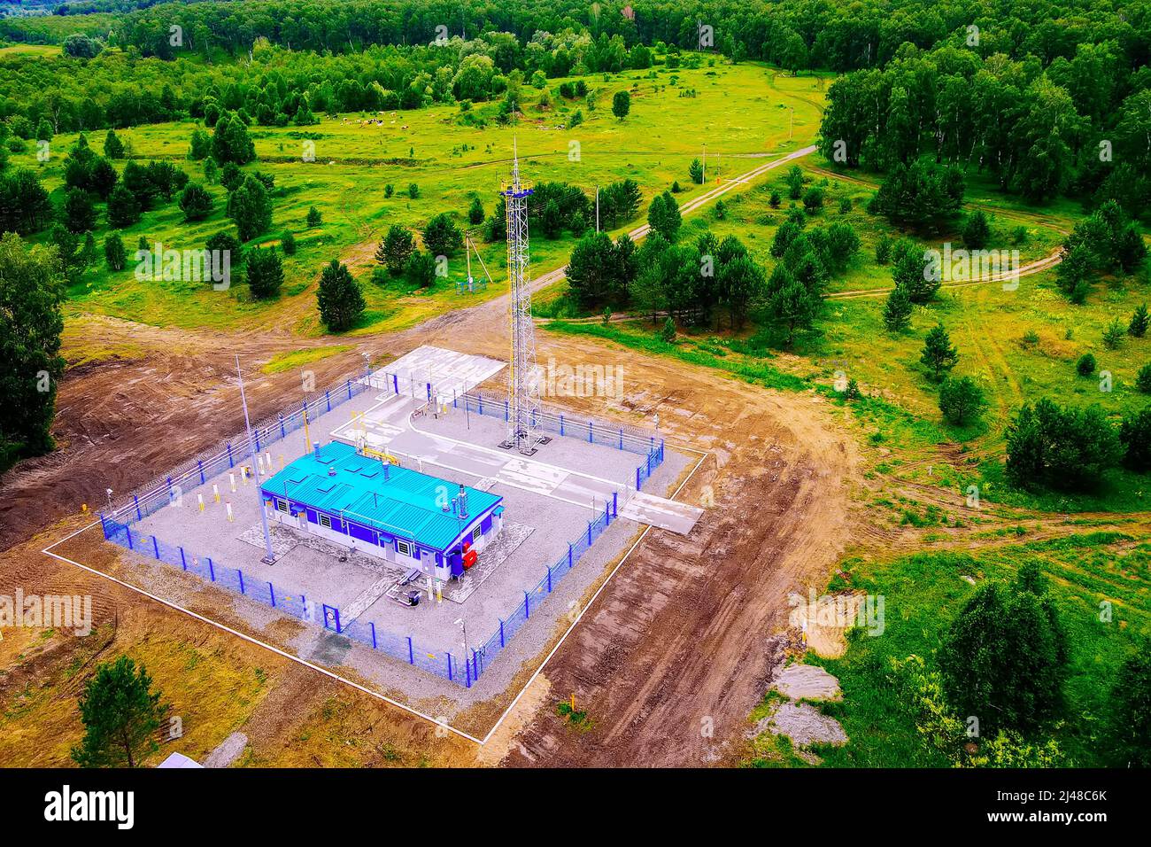 Natural gas distribution station of main gas pipeline. View from above. Type of gasification object on summer day. Construction of gas pipeline. Stock Photo