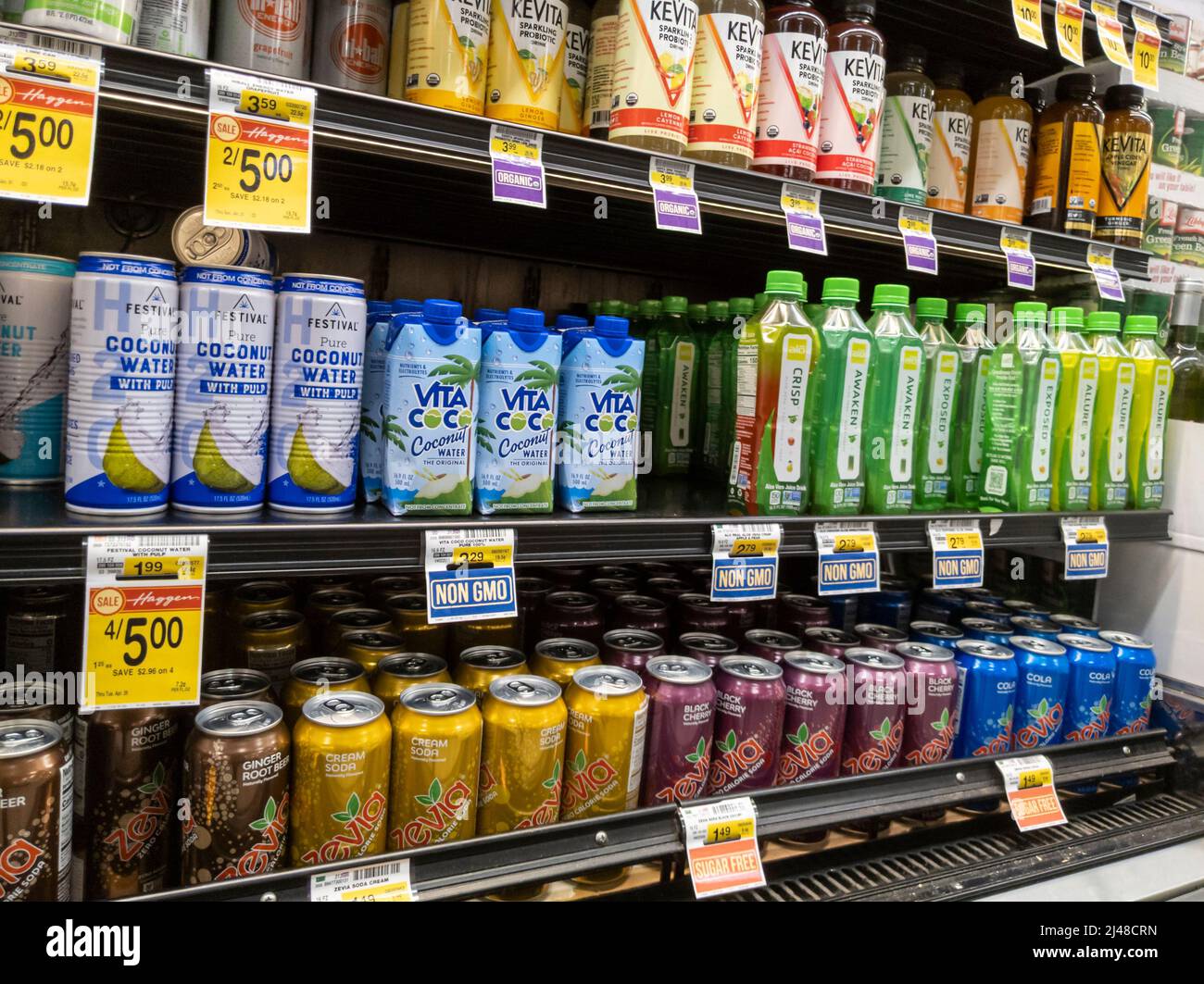 Woodinville, WA USA - circa April 2022: Angled view of coconut water and soda for sale inside a Haggen grocery store. Stock Photo