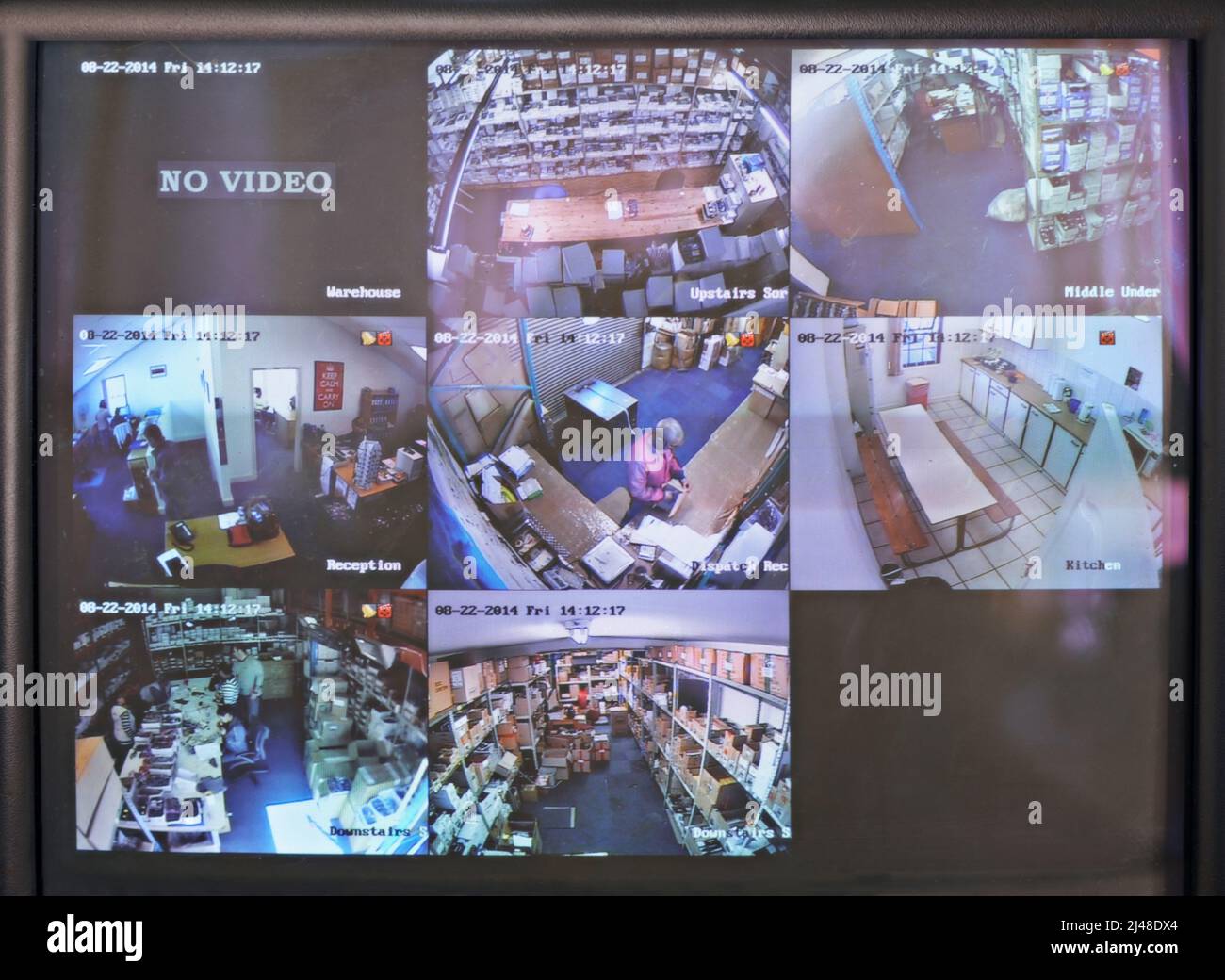 Keeping an eye for security. Shot of a close circuit tv monitor watching a factory floor. Stock Photo