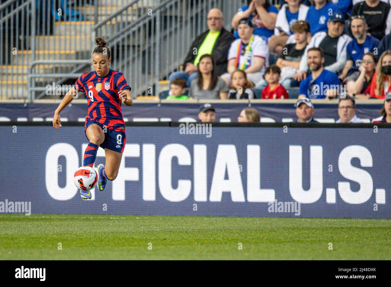 Mallory Swanson Pugh dribbling during a US women's national team soccer game. Professional woman footballer / women playing soccer Stock Photo