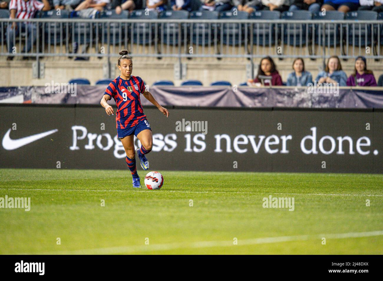 Mallory Swanson Pugh dribbling during a US women's national team soccer game. Professional woman footballer / women playing soccer Stock Photo