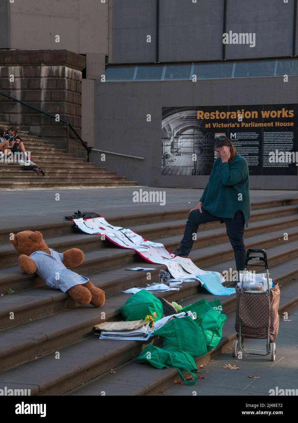 Lone protestor setting up for the day at State Parliament on Spring Street, Melbourne Stock Photo