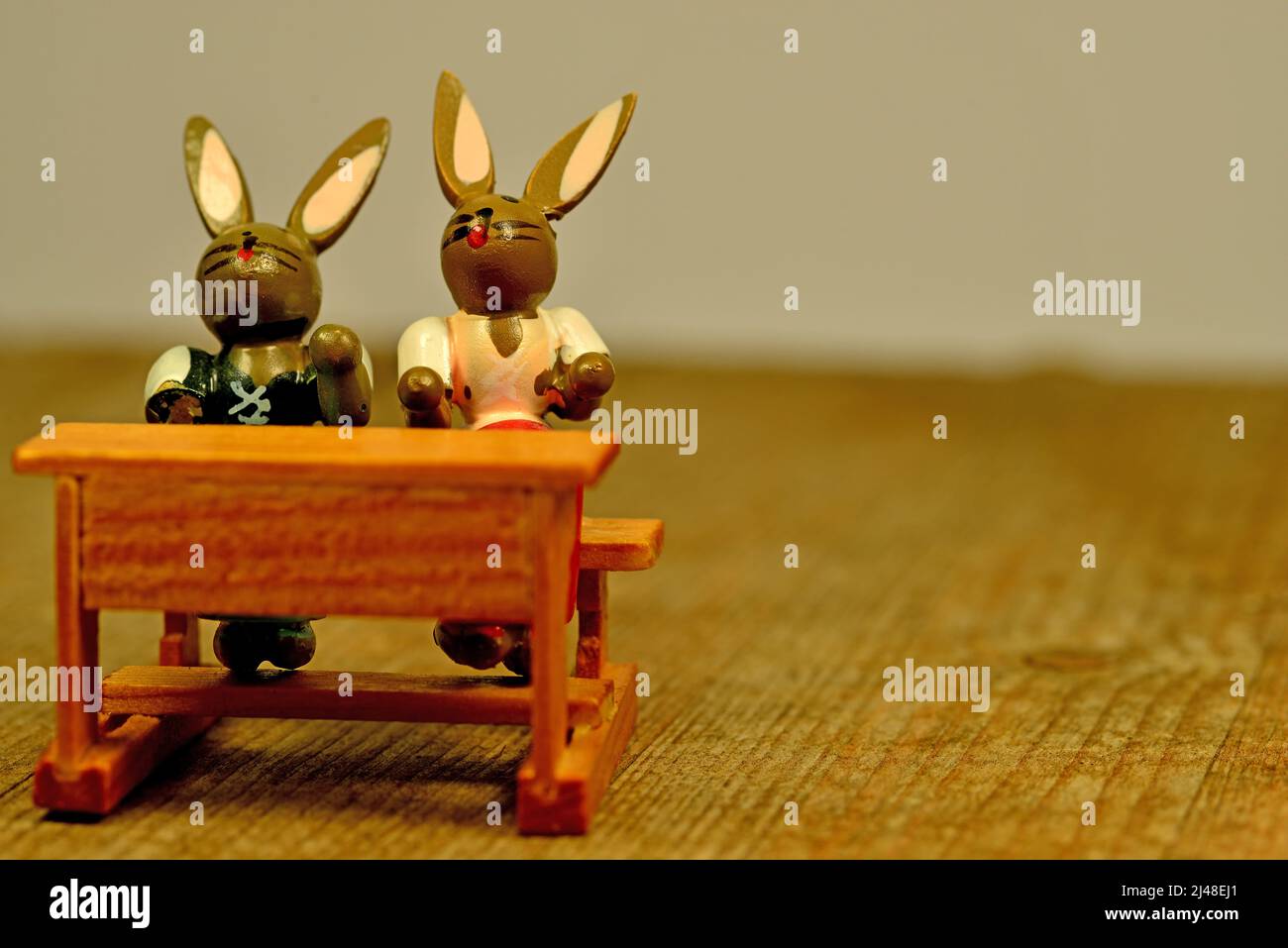 easter bunnies on the school bench Stock Photo