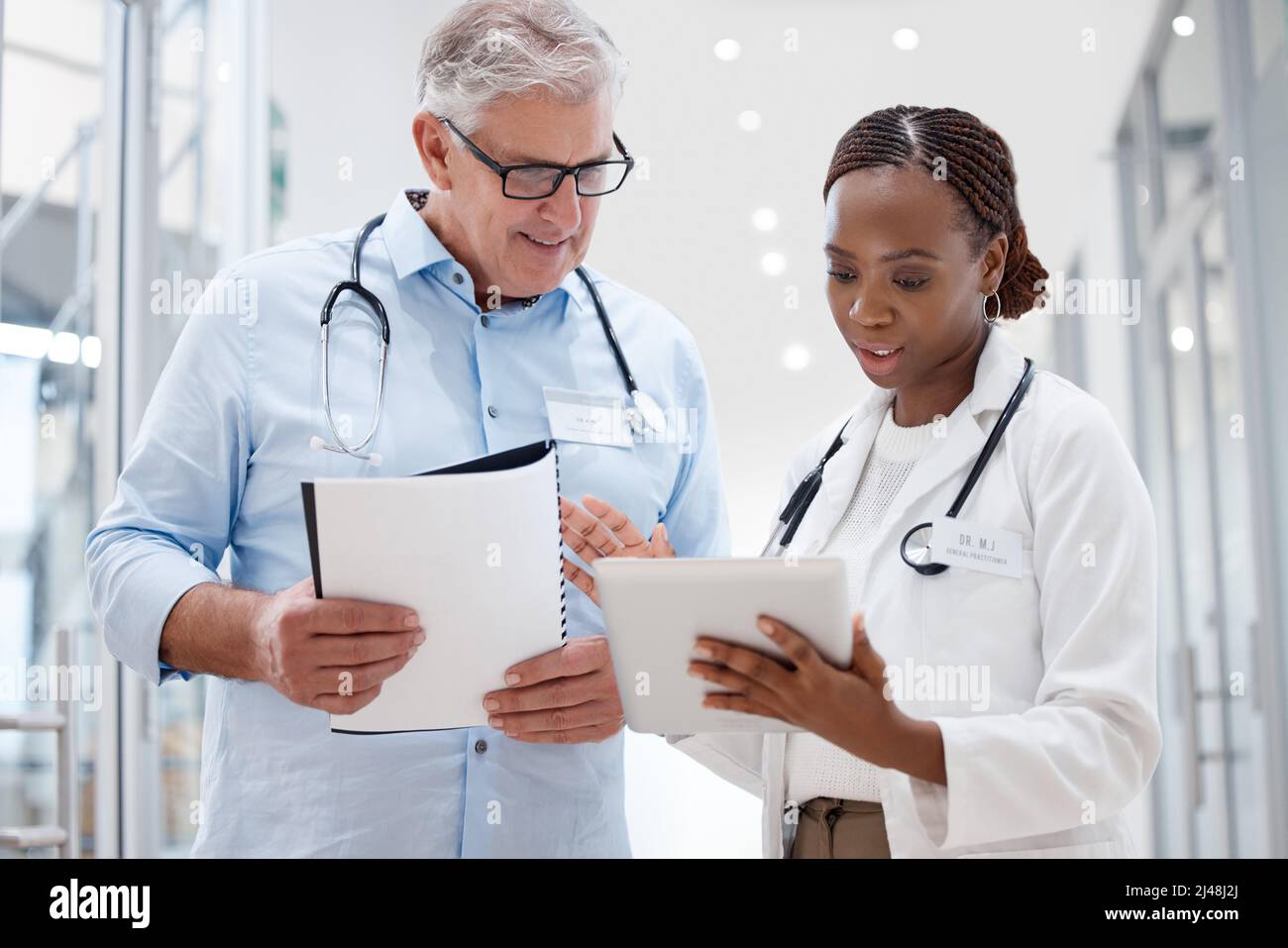 You have some great ideas. Shot of two doctors discussing a patients results. Stock Photo