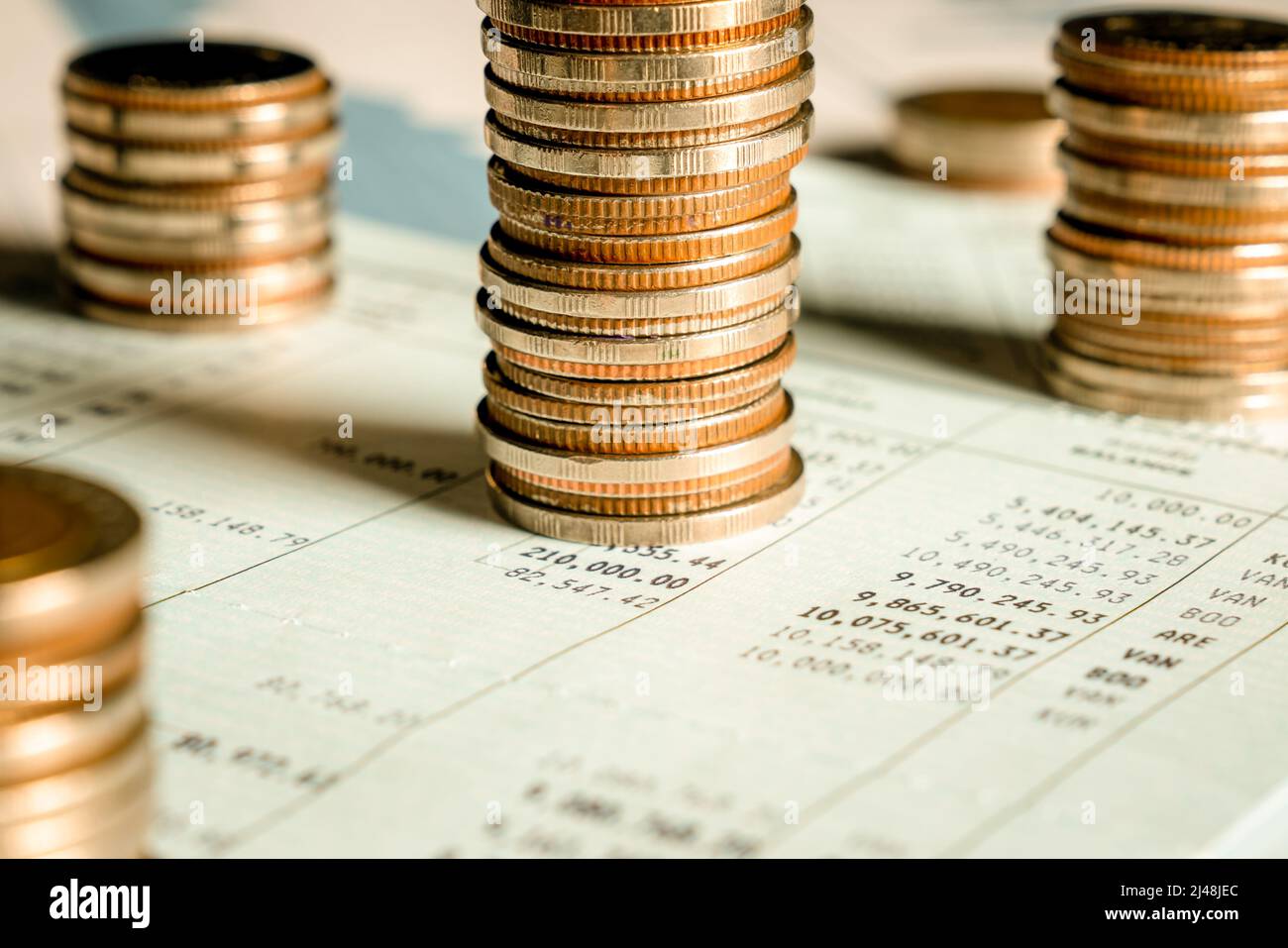 Pile of gold coins stack in finance treasury deposit bank account for