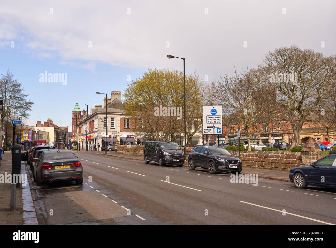 Main road and shops in a town center Stock Photo Alamy