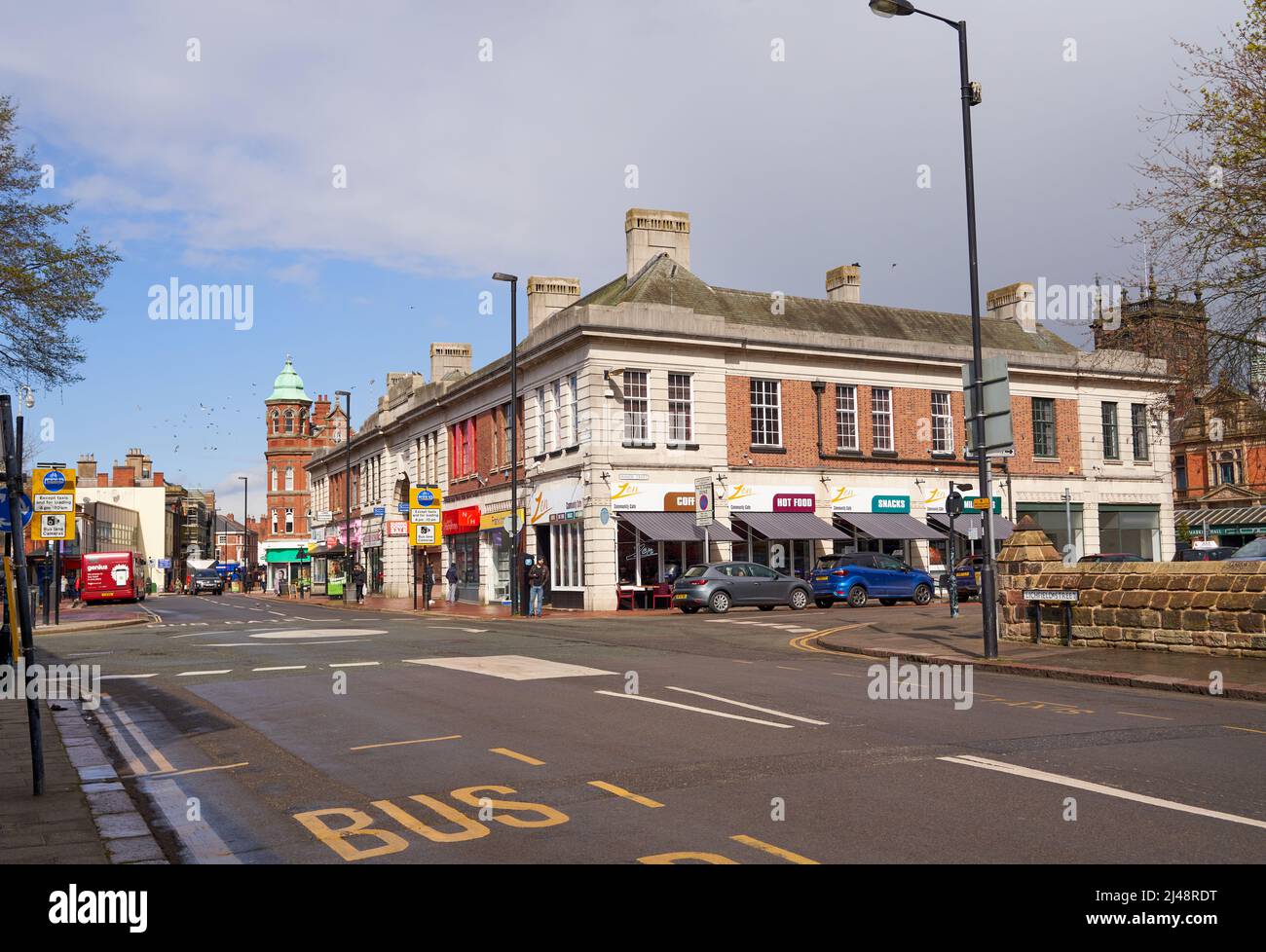 Main road and shops in a town center Stock Photo Alamy