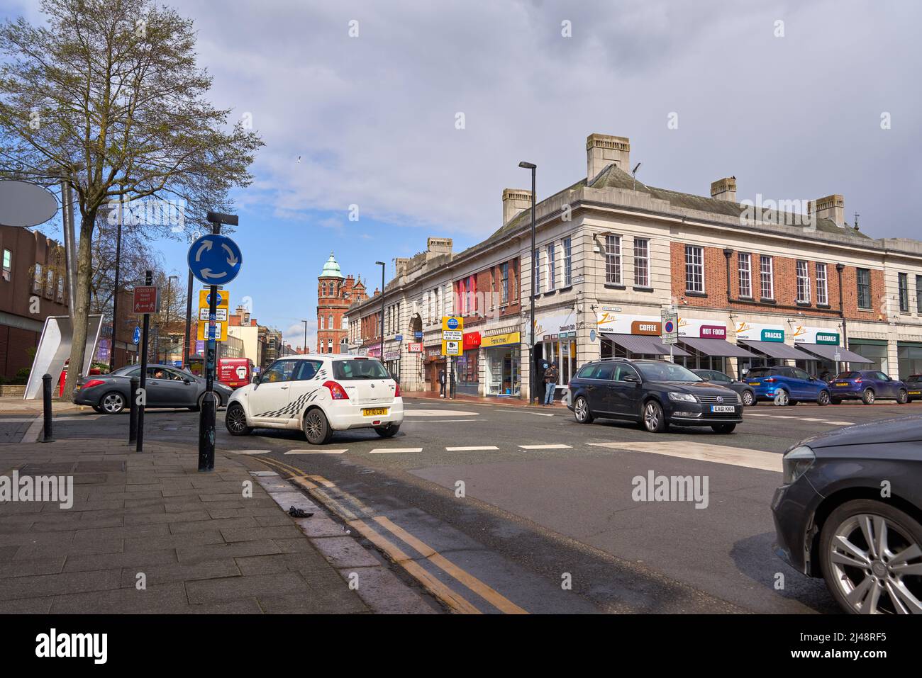 Main road and shops in a town center Stock Photo Alamy
