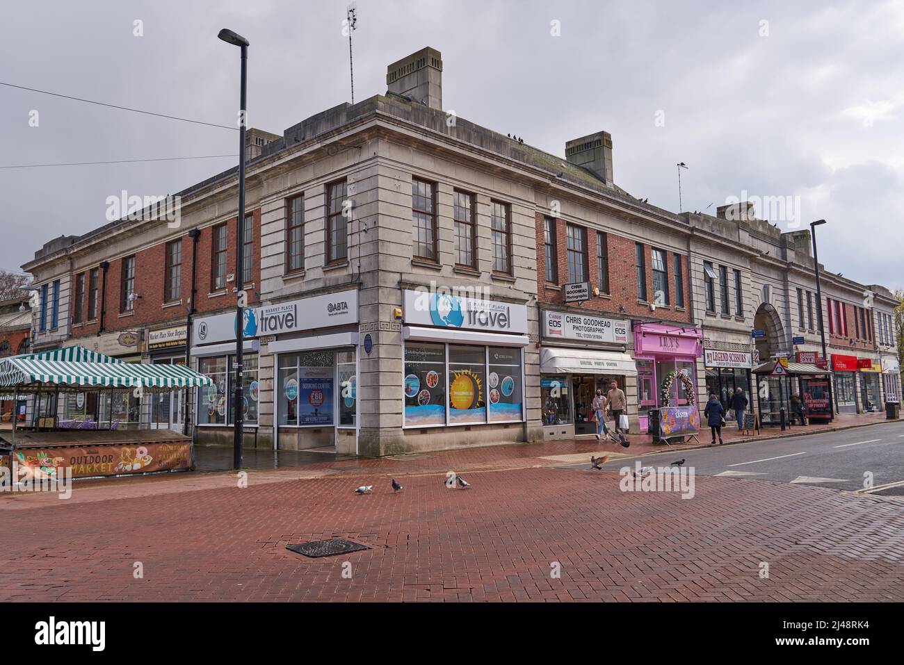 Main road and shops in a town center Stock Photo Alamy