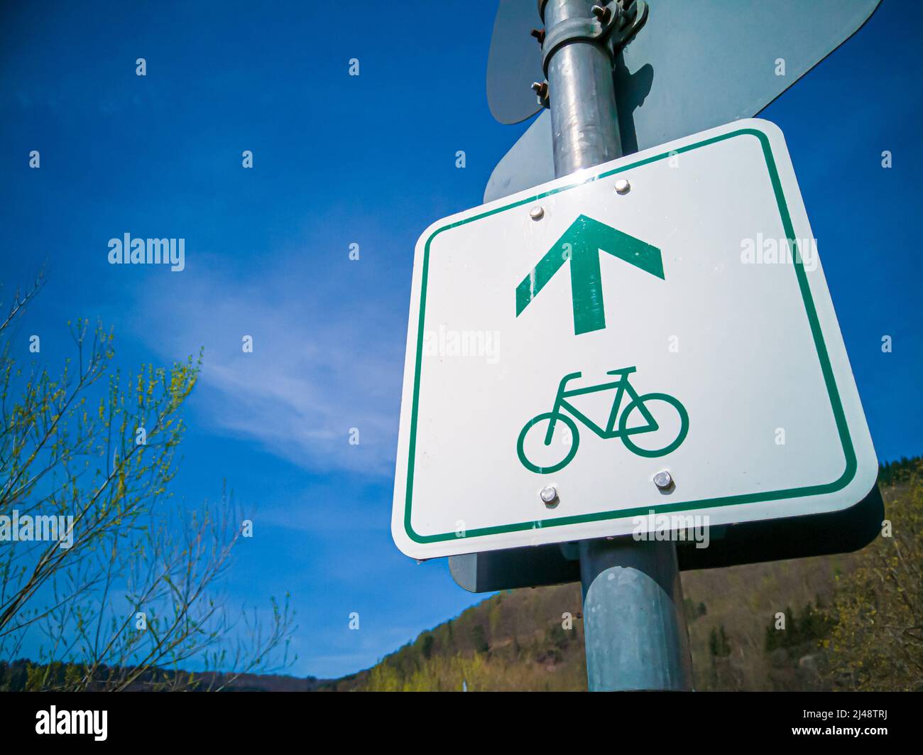 Sign indicating the direction in which a bike path runs. Bicycle