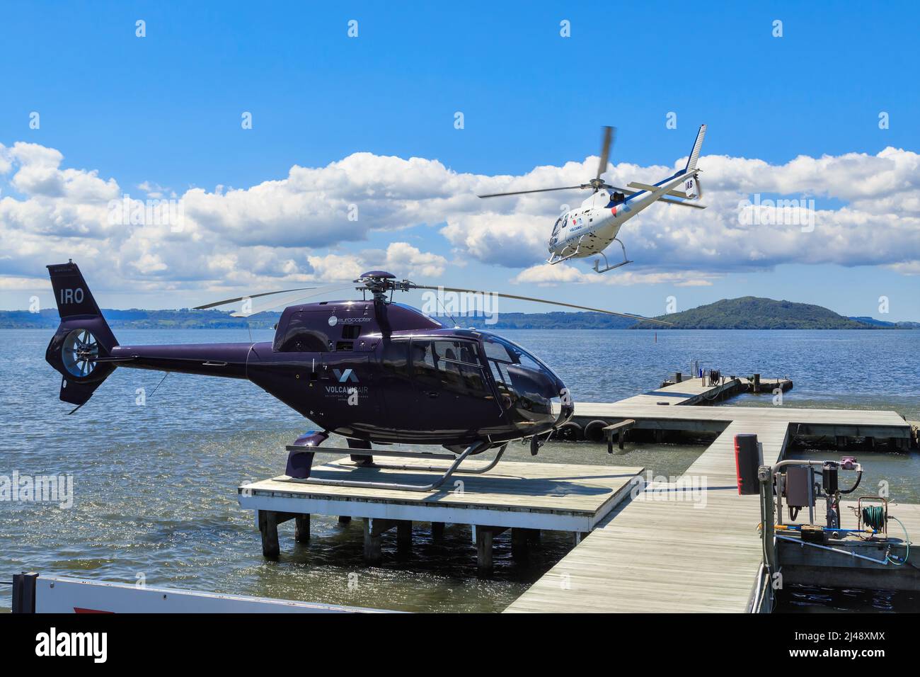 Helicopters of Volcanic Air (a tour company) at Lake Rotorua, Rotorua, New Zealand Stock Photo