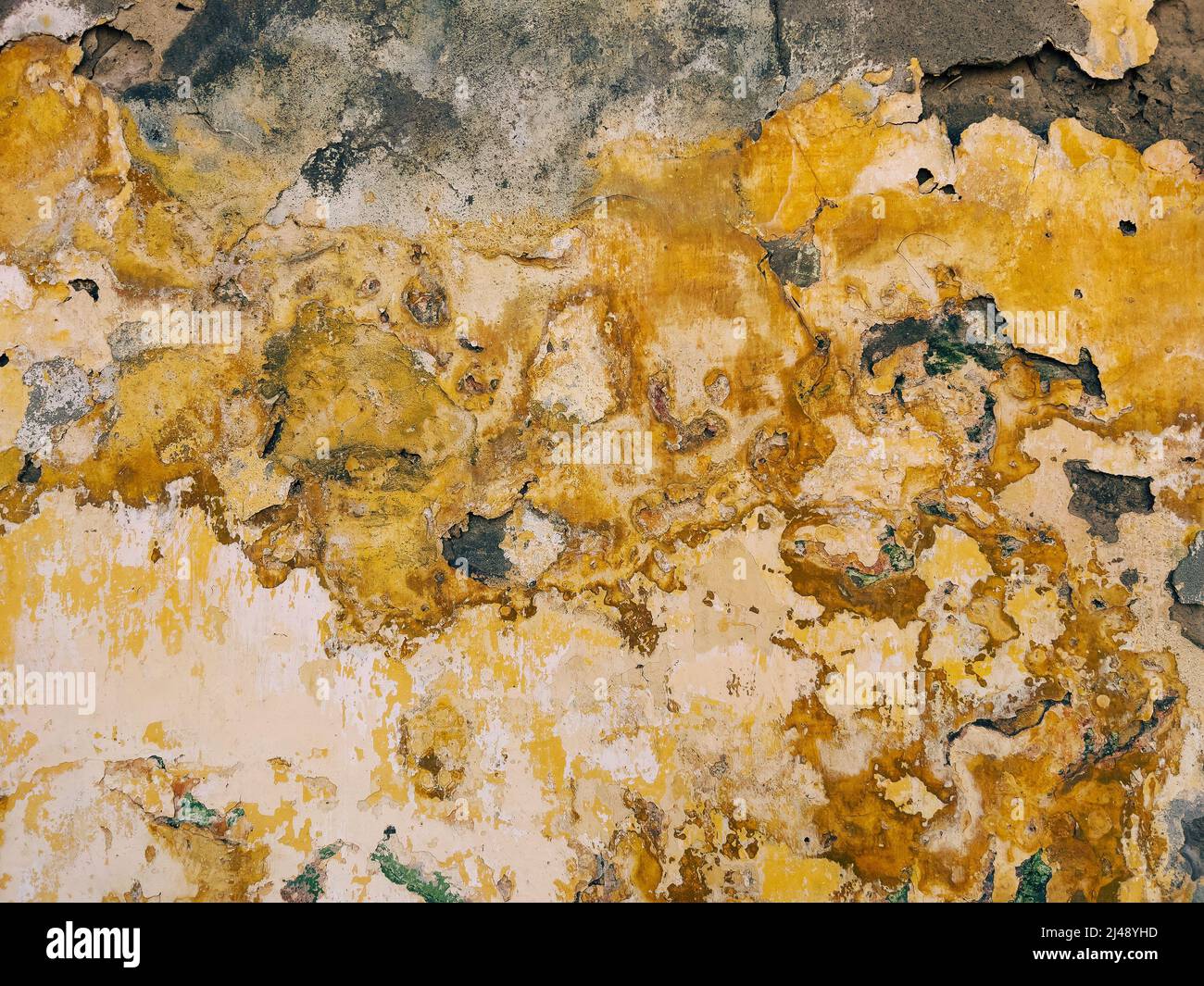 Surface of an old damaged wall as background and texture, rustic weathered facade pattern Stock Photo