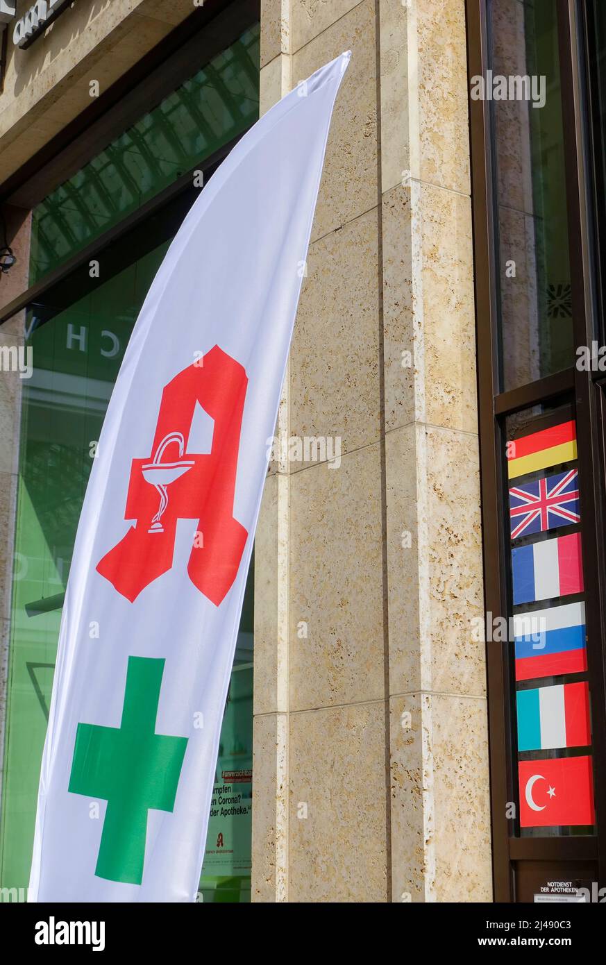 Several languages on the window of a pharmacy in Berlin Stock Photo