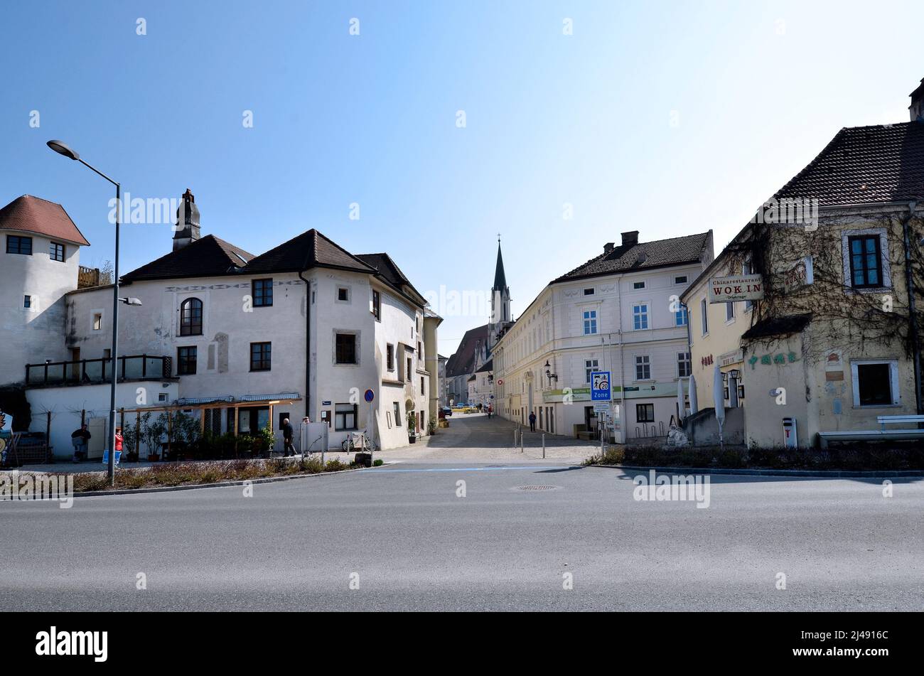 Melk, Austria - March 26, 2022: Townscape with pedestrian zone and Parish Church of the Assumption of the Virgin Mary in zhe UNESCO world heritage sit Stock Photo