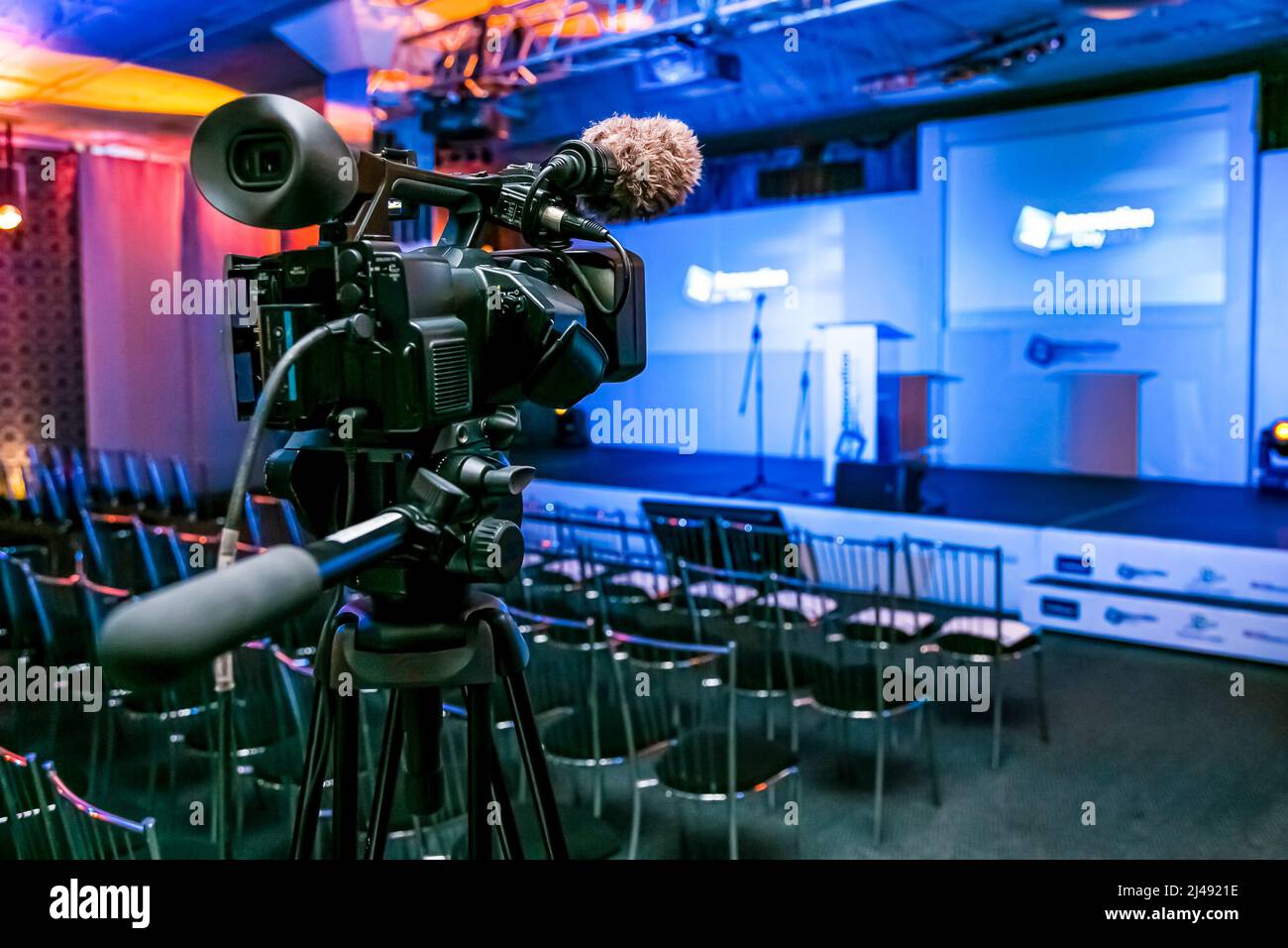 Broadcast TV Camera on a live film set in conference hall Stock Photo