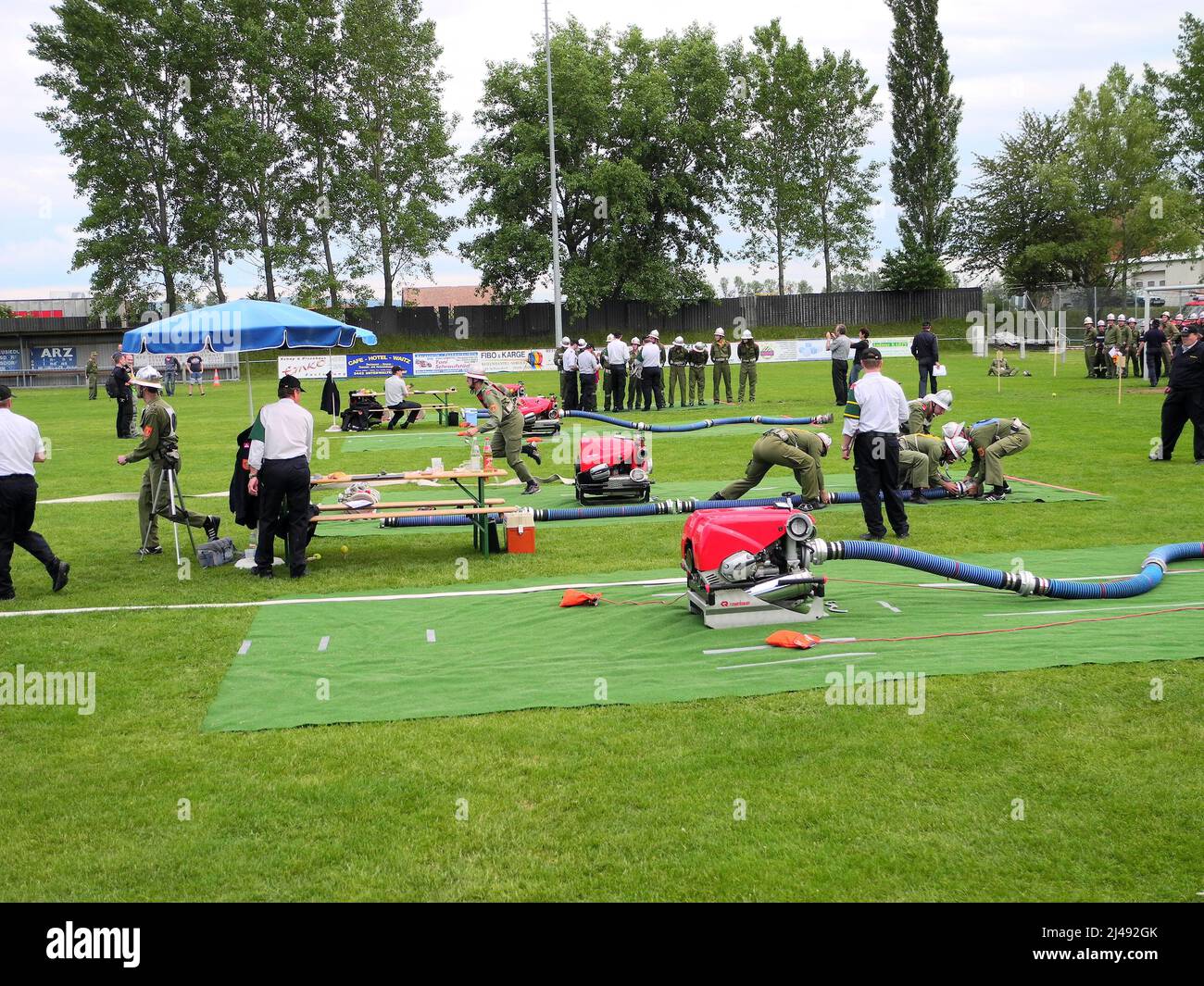 Reisenberg, Austria - June 02, 2012: Unidentifed people by competition for fire brigades on a public sports field Stock Photo