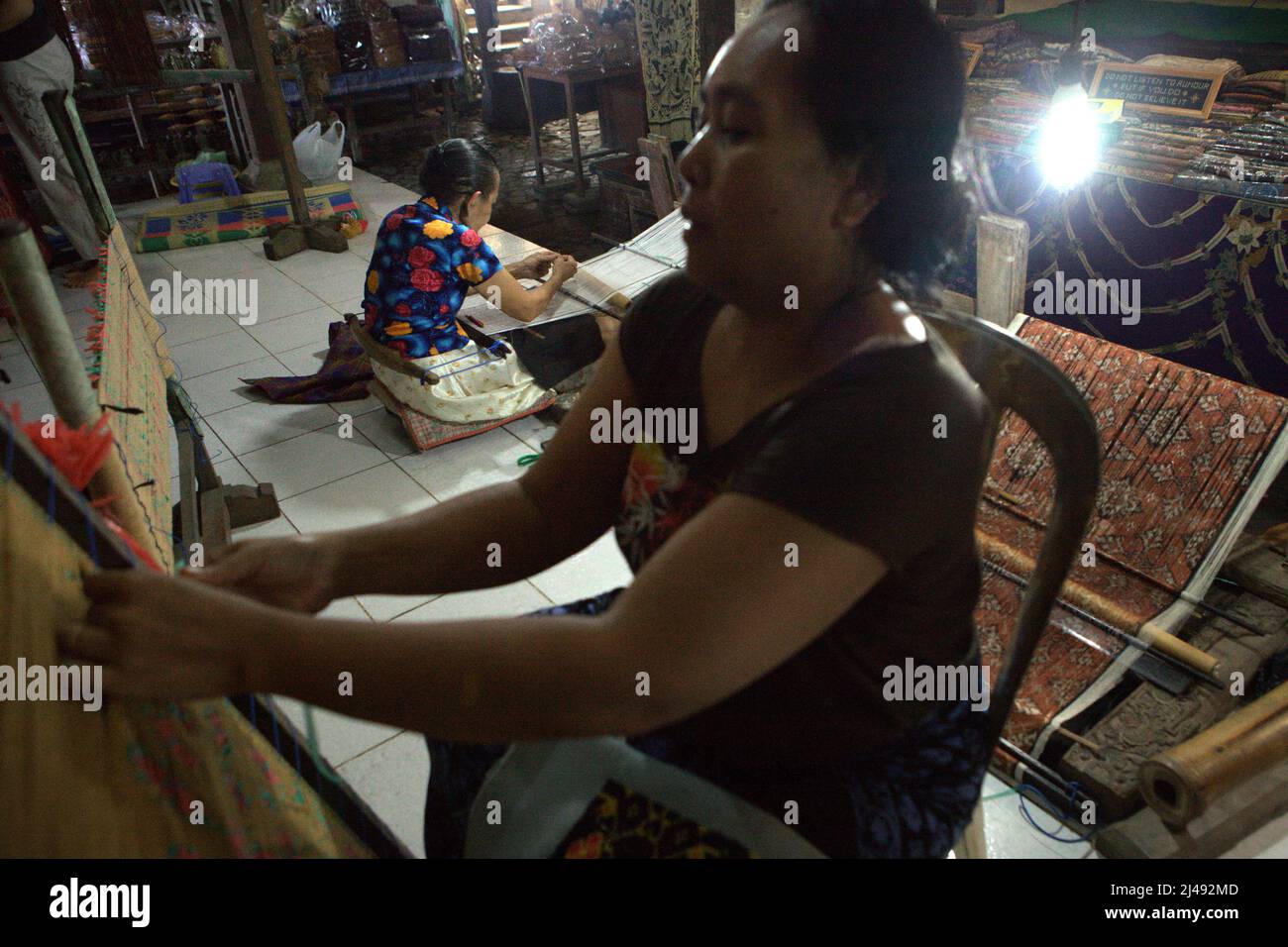 Women weaving in the traditional village of Tenganan Pegringsingan in