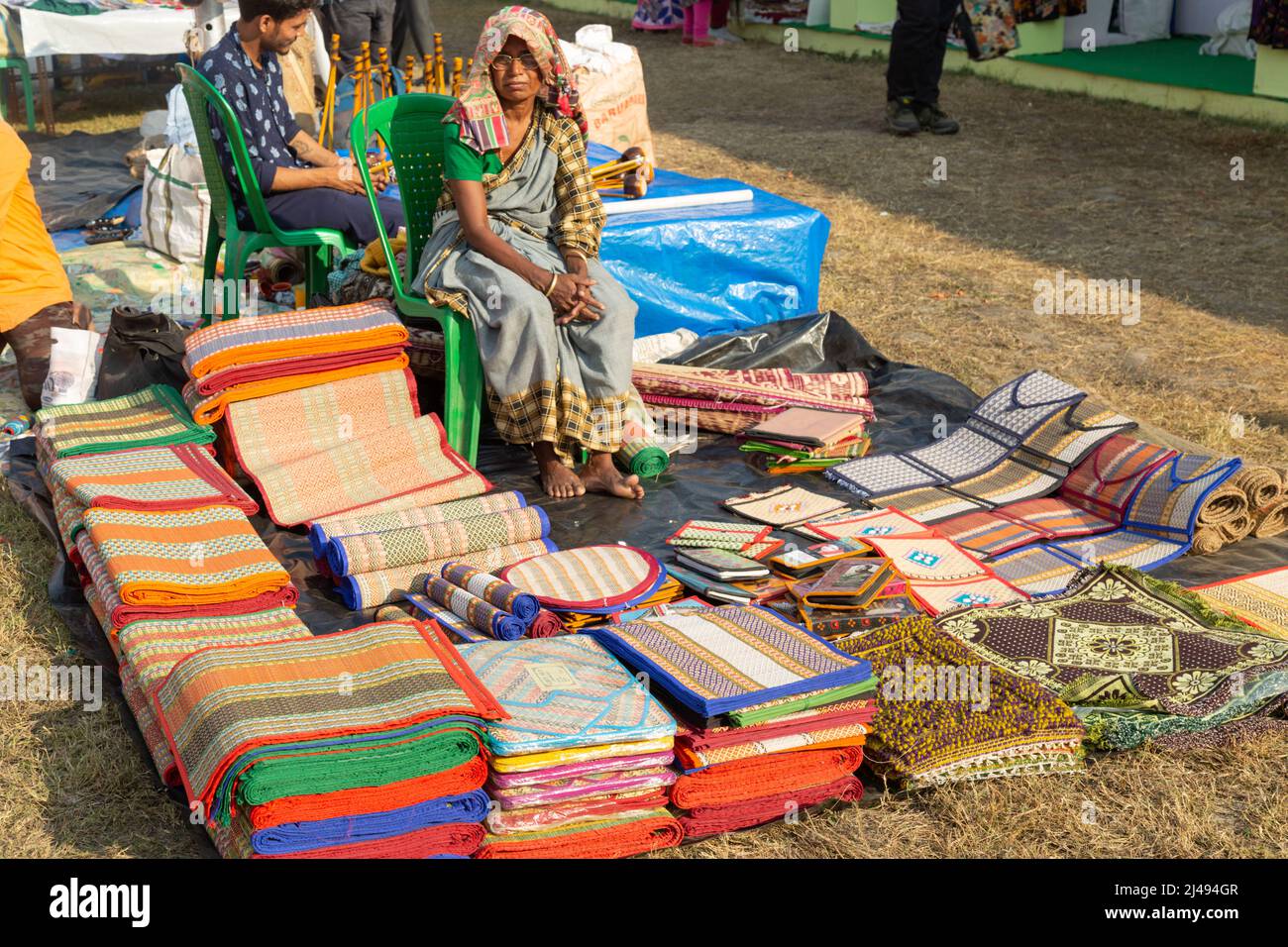 Rural woman selling handmade jute items at a handicraft fair at Kolkata, India. Stock Photo