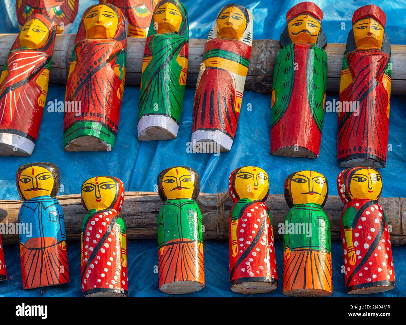 Handmade wooden craft items on display for sale at a handicraft fair at