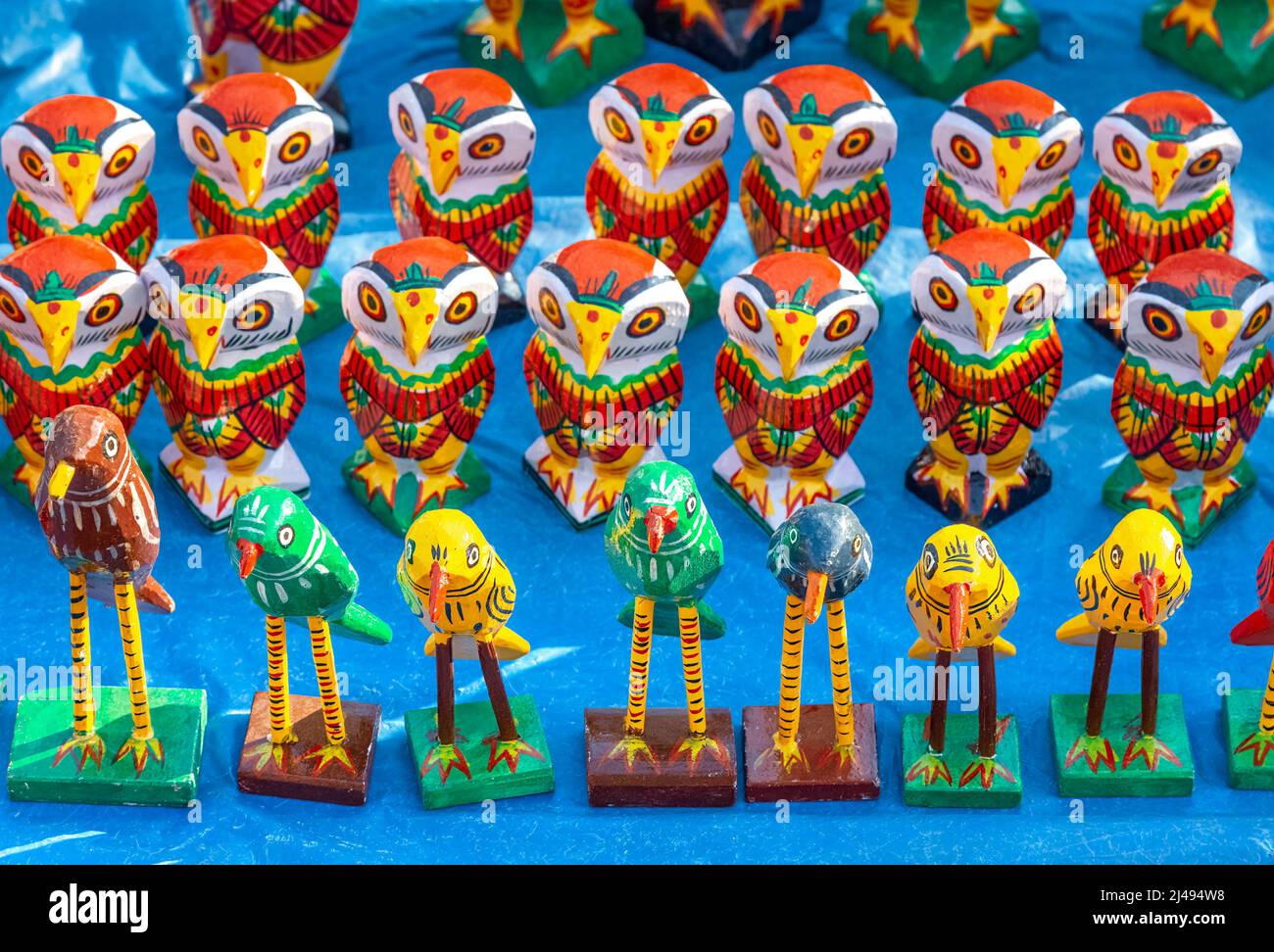 Handmade wooden craft items on display for sale at a handicraft fair at