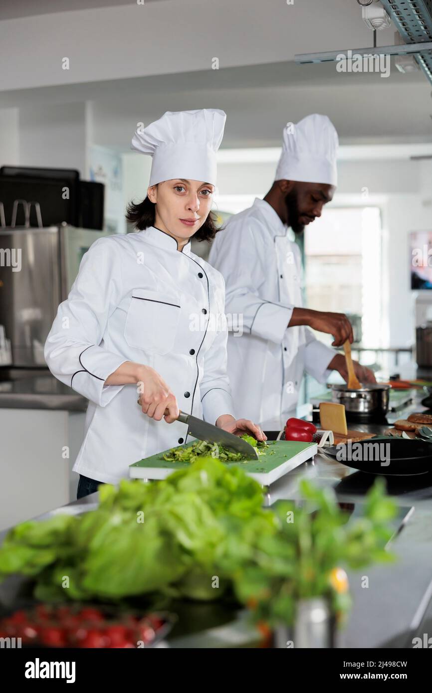 Multiracial food industry workers standing in restaurant professional