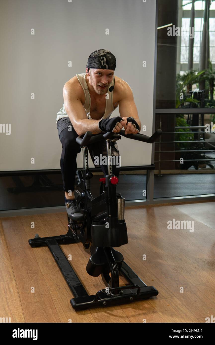 Trainer bicycle a athlete on up pumped bike legs training gym healthy