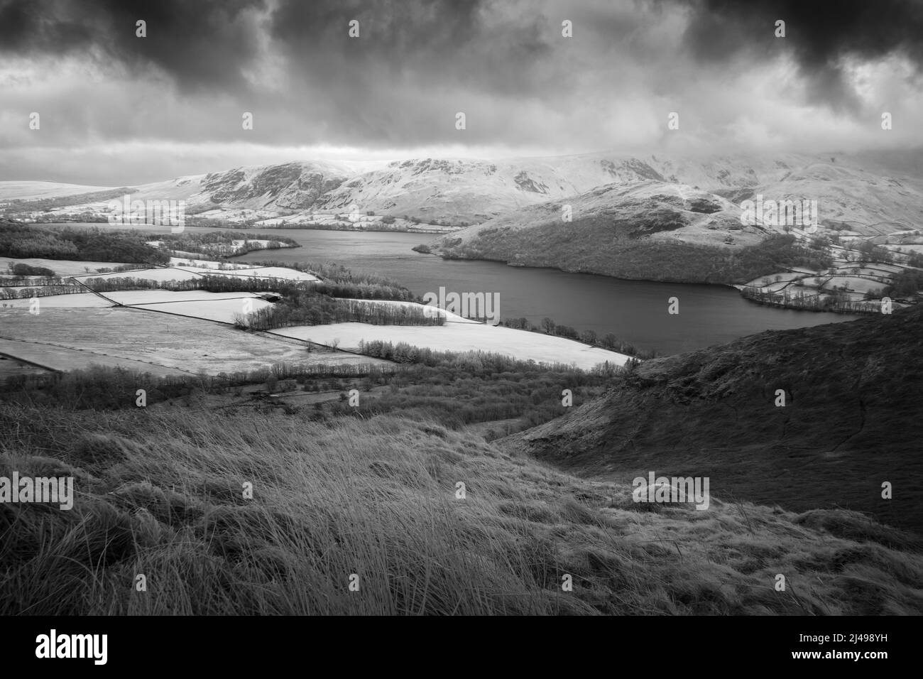 A black and white infrared view from the east slope of Gowbarrow Fell over Ullswater with Hallin Fell and Barton Fell beyond in the Lake District National Park, Cumbria, England. Stock Photo