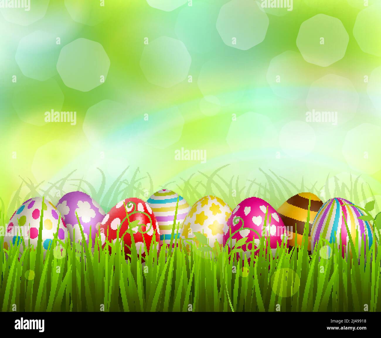 Colorful painted easter eggs on green grass on blurred background with ...