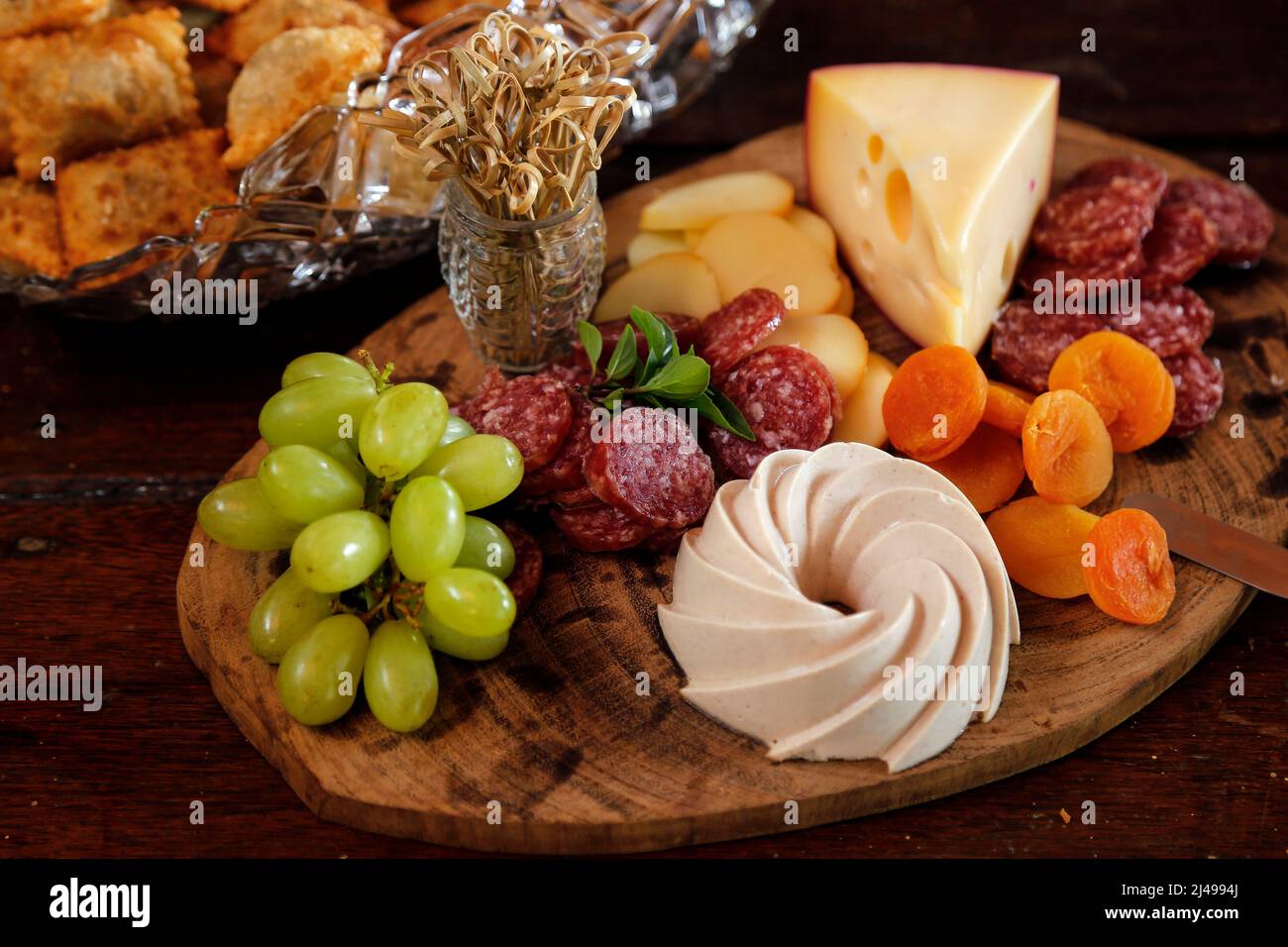 buffet served with various savory foods at a party snacks board Stock