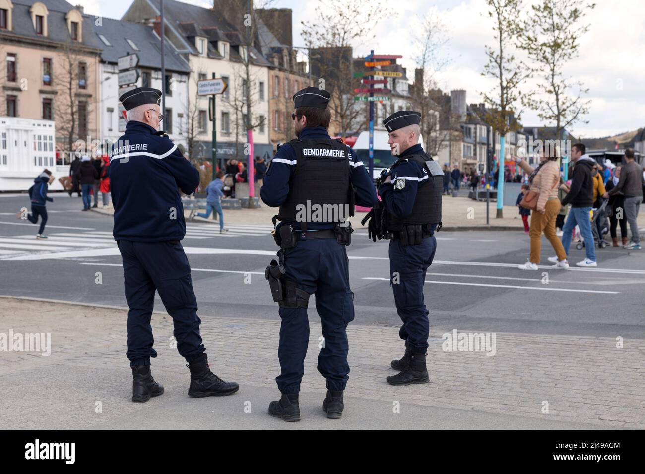 Landerneau, France - April 03 2022: Group of gendarmes monitoring the crowd during the carnival of Landerneau. Stock Photo
