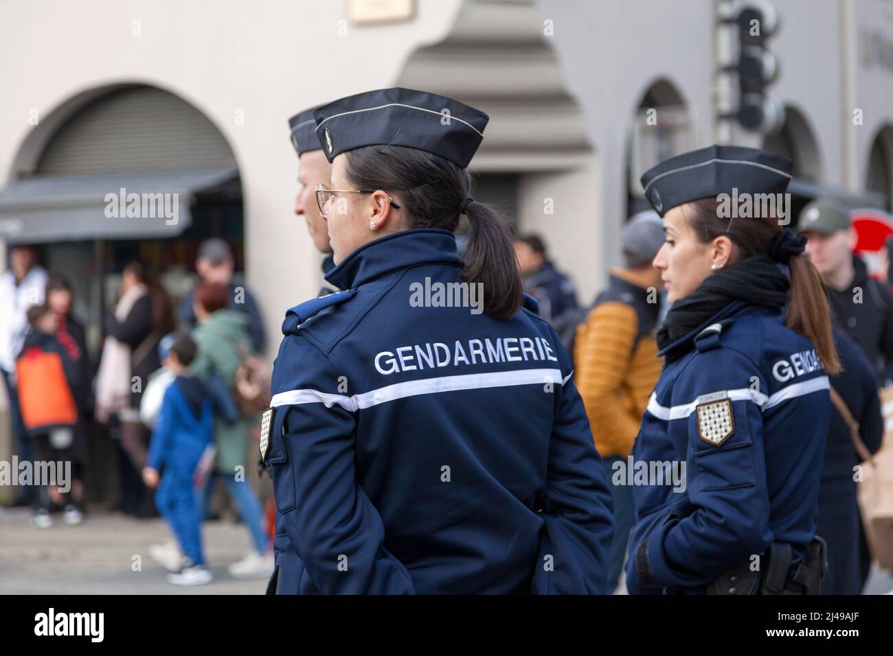 Landerneau, France - April 03 2022: Group of gendarmes surveilling the crowd during the carnival of Landerneau. Stock Photo