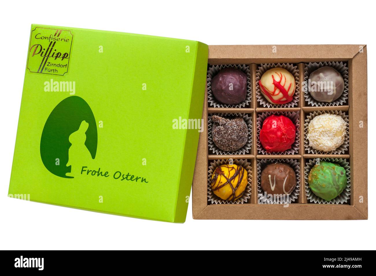 Box of Easter chocolates from Confiserie Pillipp Zirndorf Furth - Frohe Ostern with lid removed to show contents isolated on white background Stock Photo
